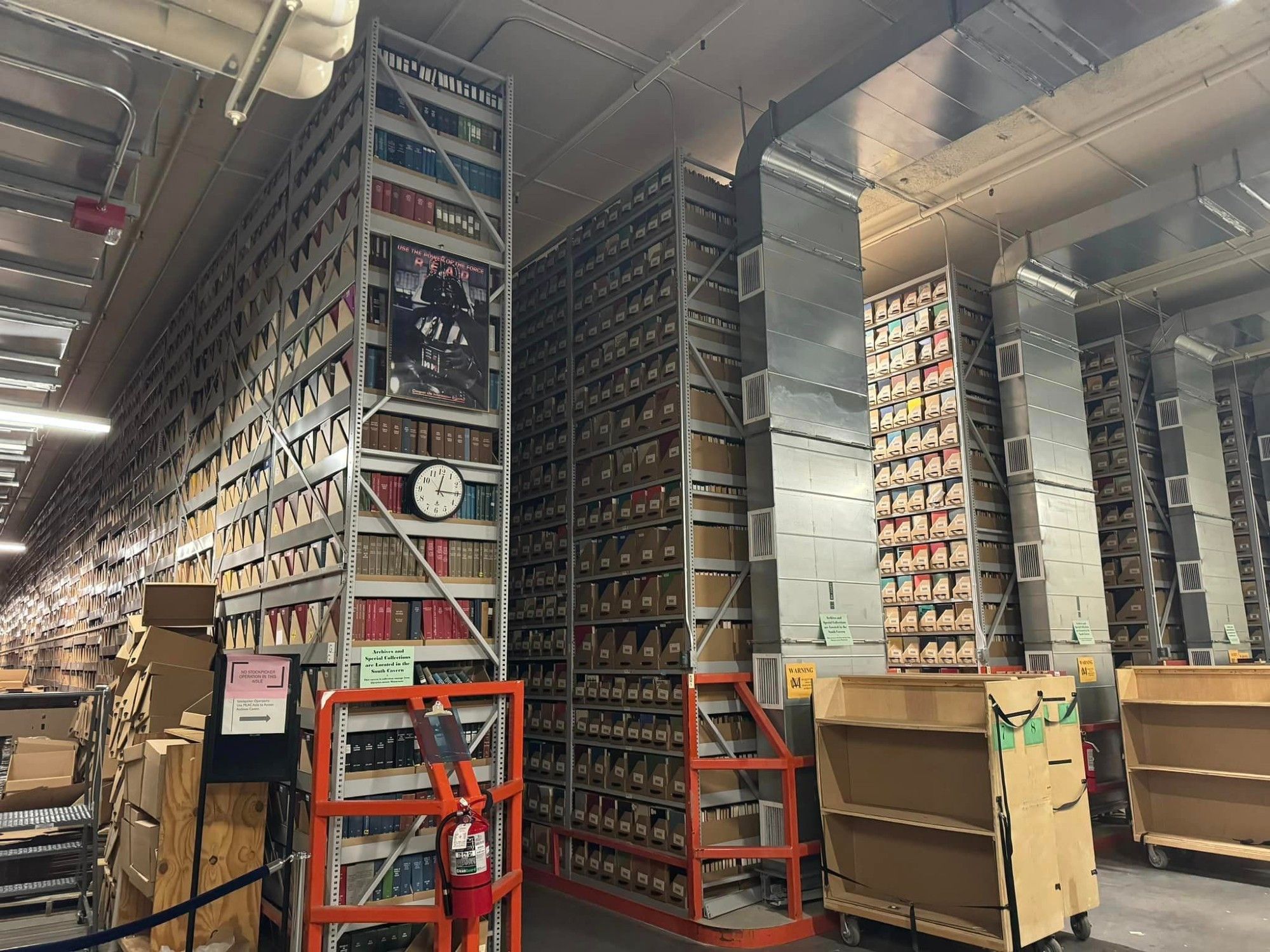 Stacks of shelves 17 feet high surrounded by silver ductwork to control airflow.