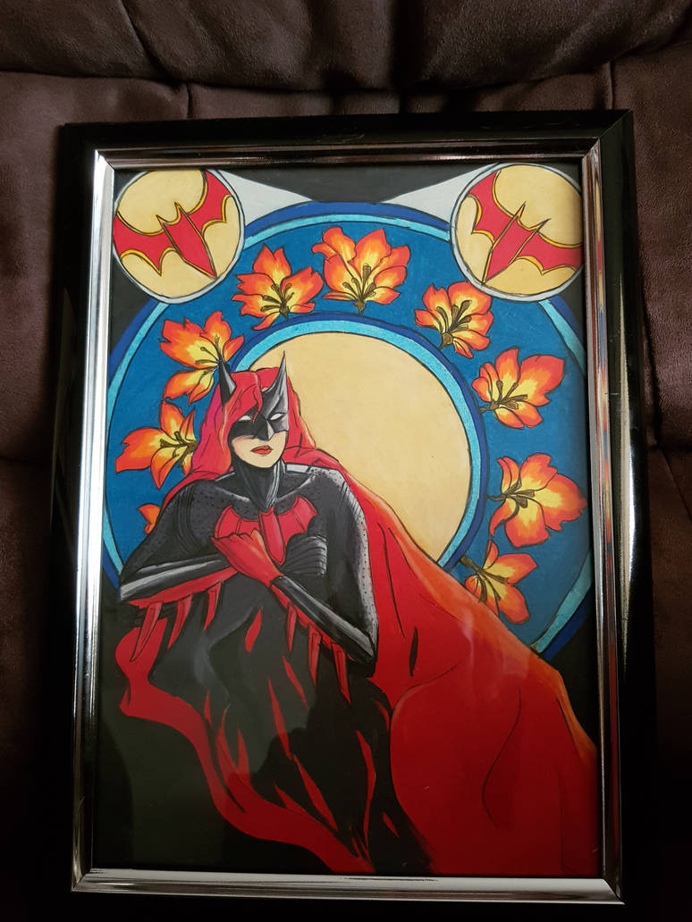 An A4 framed drawing of Batwoman drawn in Prismacolour pencils. Her arms are crossed over her chest.