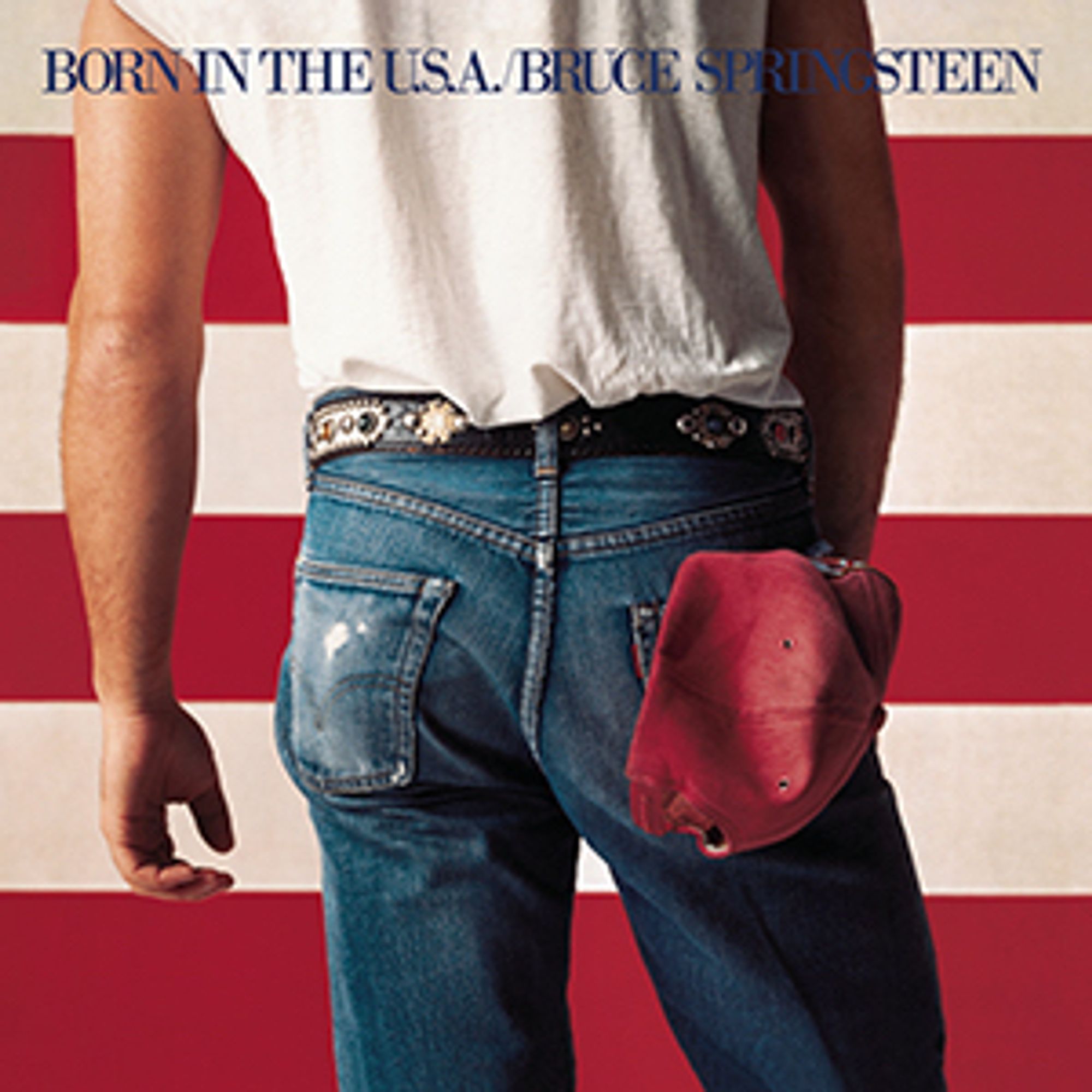 The cover of Born in the U.S.A. the seventh studio album by the American singer-songwriter Bruce Springsteen, released on June 4, 1984. Bruce is standing in front of a red and white striped wall. Horizontal stripes, known to be slimming, give Bruce the confidence to pose for a close up of his Aristotle in snug blue jeans. He wears a white t-shirt - we can’t see the collar but we know it’s blue. The bulge in his left rear pocket is a mystery - perhaps some cigarettes to keep his trademark voice rough as a bag of spanners. There’s a red baseball cap poking out of his back right pocket - code that Bruce will submit to dynamic pricing for his concert tickets - a desire he’ll have to wait years to be fulfilled. Bruce is desperate for a gazebo that’s bigger than Jon Bon Jovi’s; one that will fit a jacuzzi and a snooker table. That will be glory days.