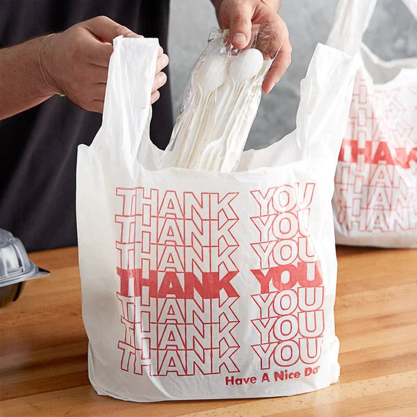 plastic bag that has a graphic with 7 rows of “THANK YOU” stacked up