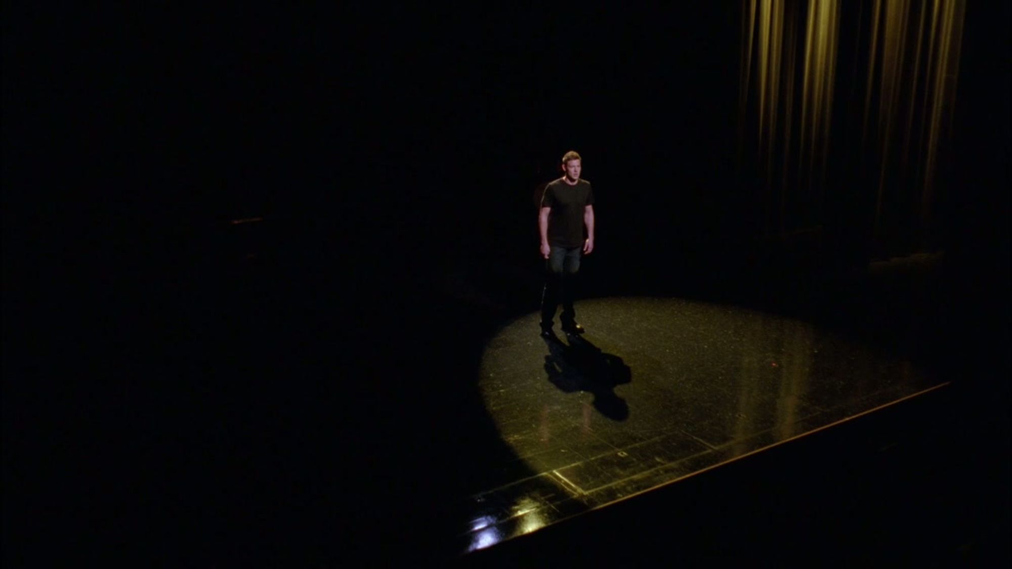 Finn Hudson standing by himself onstage, a single spotlight illuminating him. He's sad. It's sad.