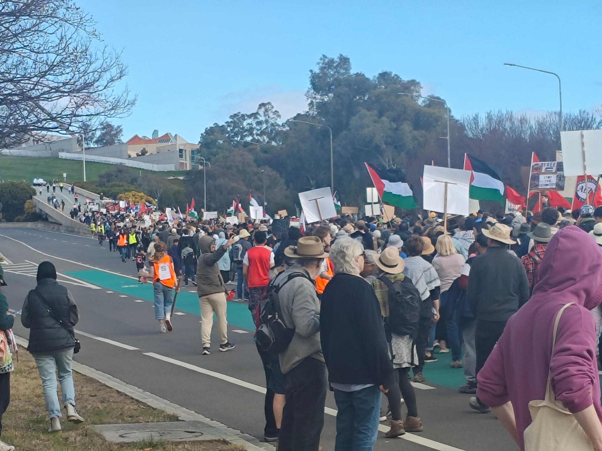 The rally heading up into parliament house. Lots of Palestinian flags 🍉✊