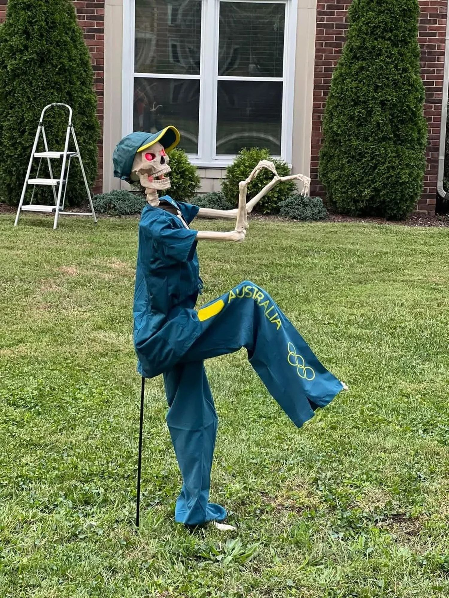 A skeleton dressed and posed in the manner of "Raygun," the Australian breakdancing Olympian