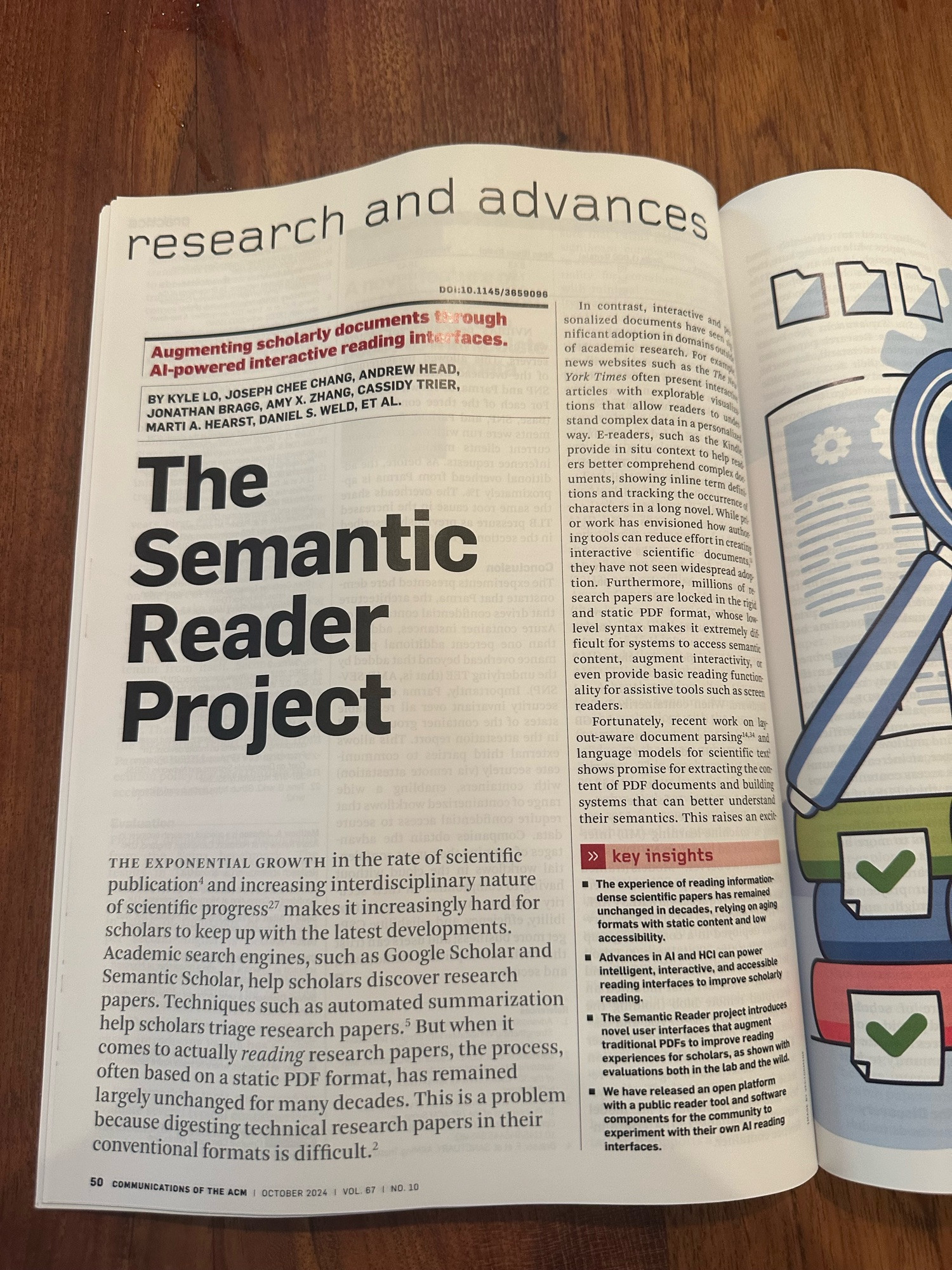 CACM magazine open on a table to page 50 with an article on The Semantic Reader Project