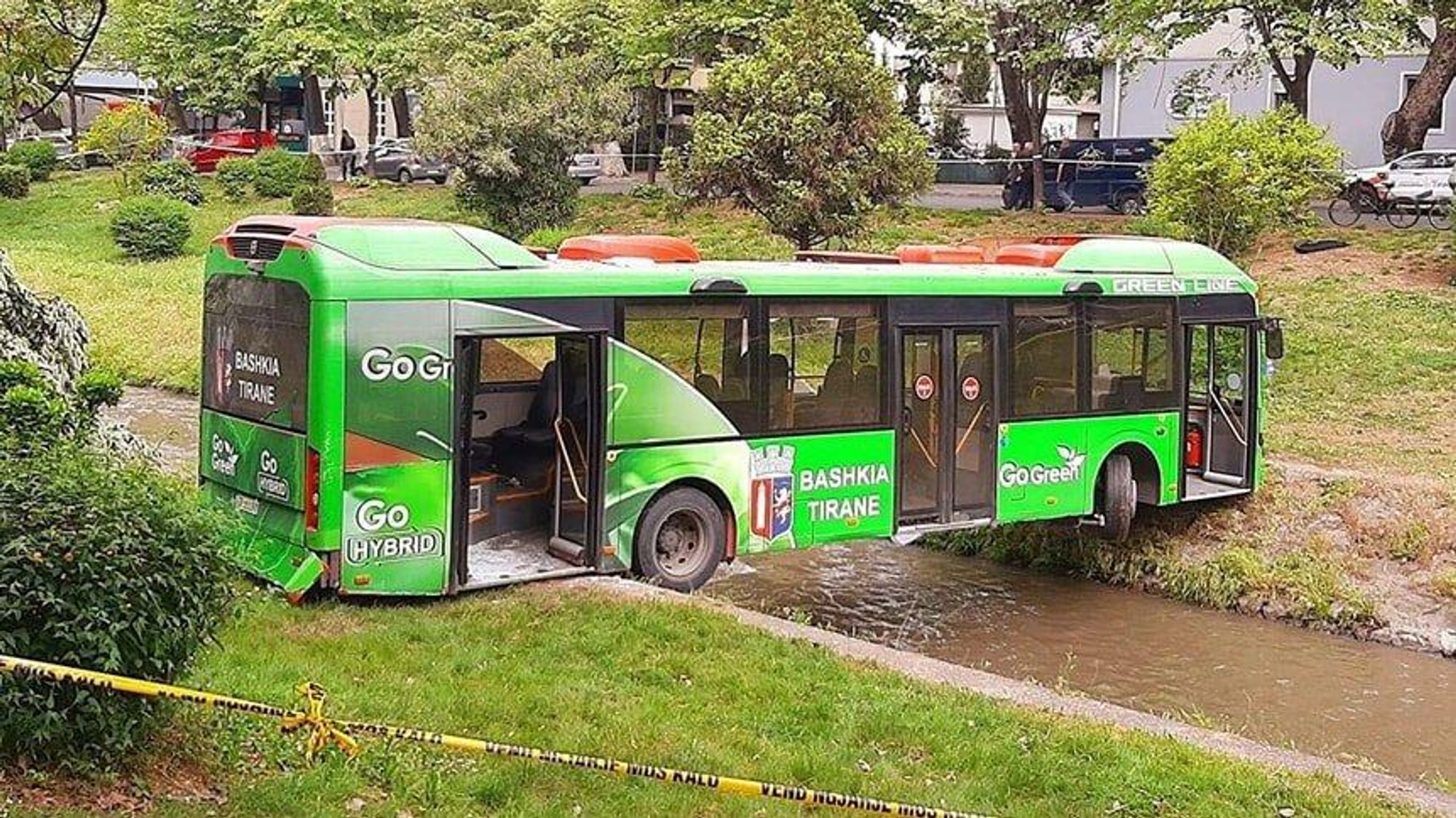 From real life. A bus that has been stranded across a river following a flood, making an unusual bridge.