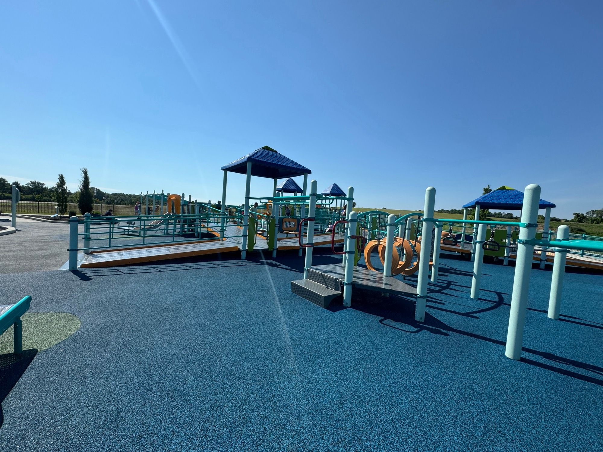 Playground with hanging bars, ramps, sun covers, climbing rings