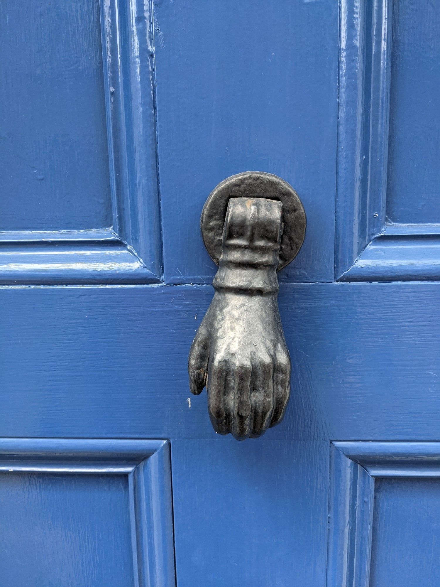 A door knocker shaped like a hand