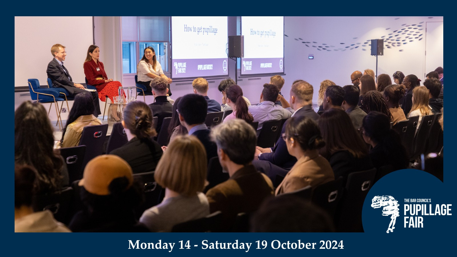 Navy frame around an image of a panel session with 3 speakers on stage and the backs of audience heads. the Bar Council's pupillage Fair logo is in the bottom right corner and the white text at the bottom of the frame reads Monday 14 to Saturday 19 October 2024