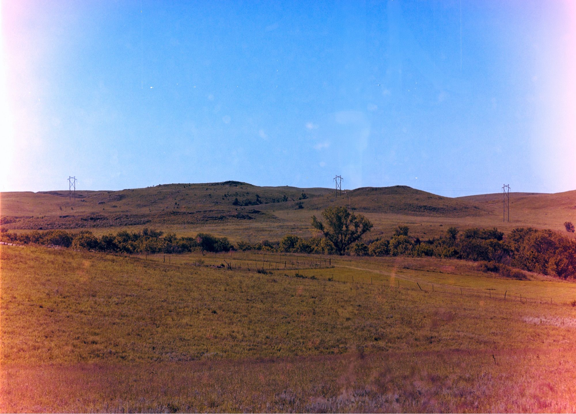 A film photograph of a wide vista with light leaks on the side of the image.