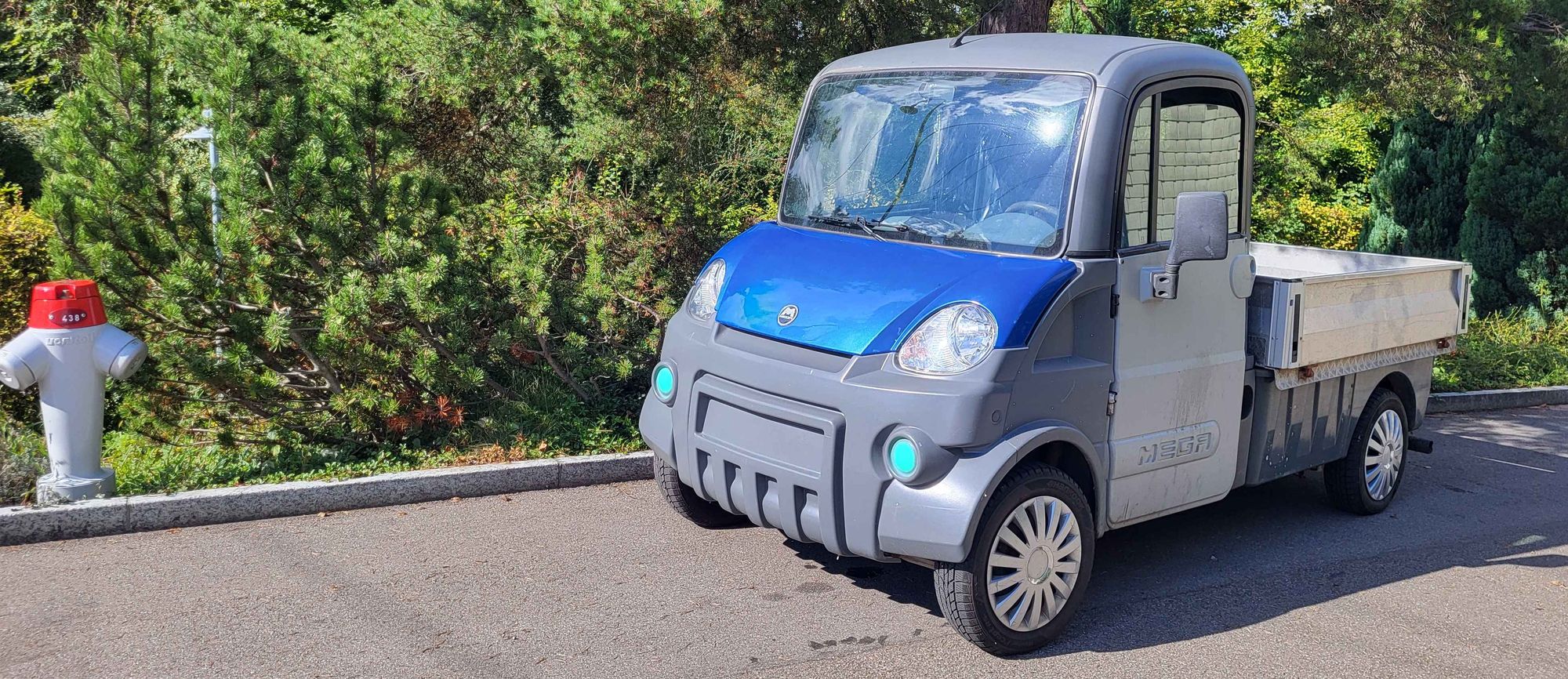 A cute, tiny practical work pickup truck.