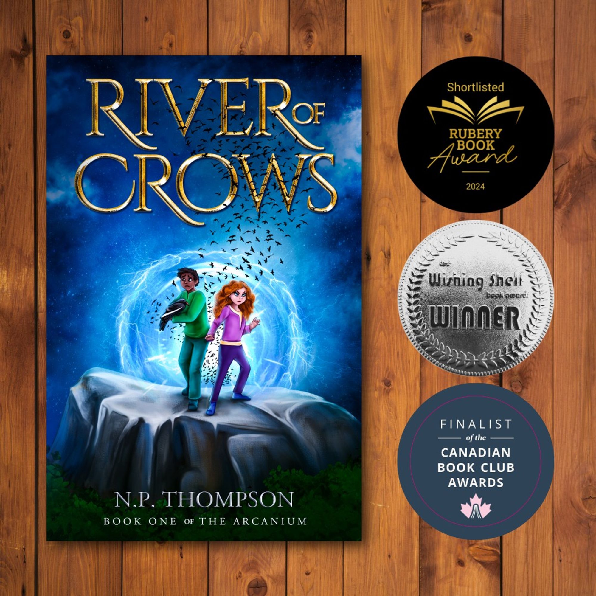 The cover of River of Crows against a brown wooden background. To the right are three book award seals the book has won: Shortlisted for the Rubery Book Award, Wishing Shelf Book Awards Silver Medal, and Finalist of the Canadian Book Club Awards.