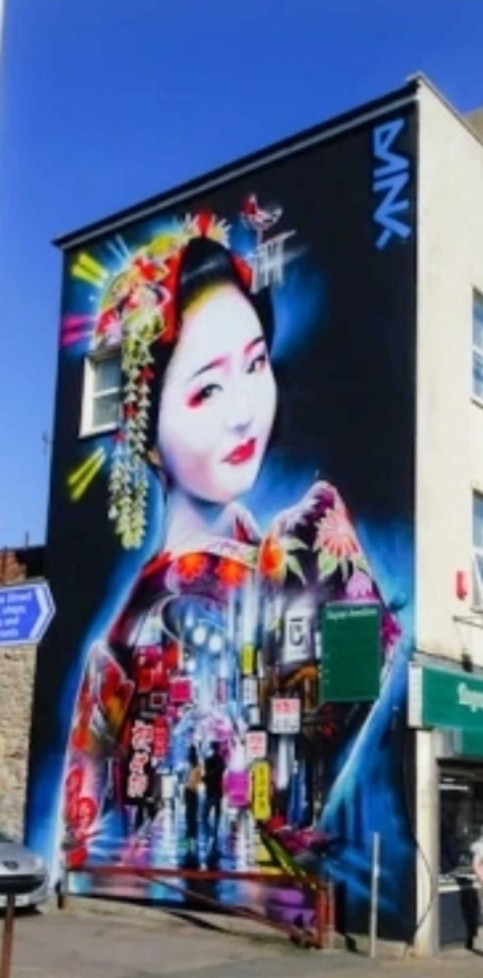 @DanKitchener mural of neonesque geisha on side of Regency Jewellers, Weston-super-mare, UK