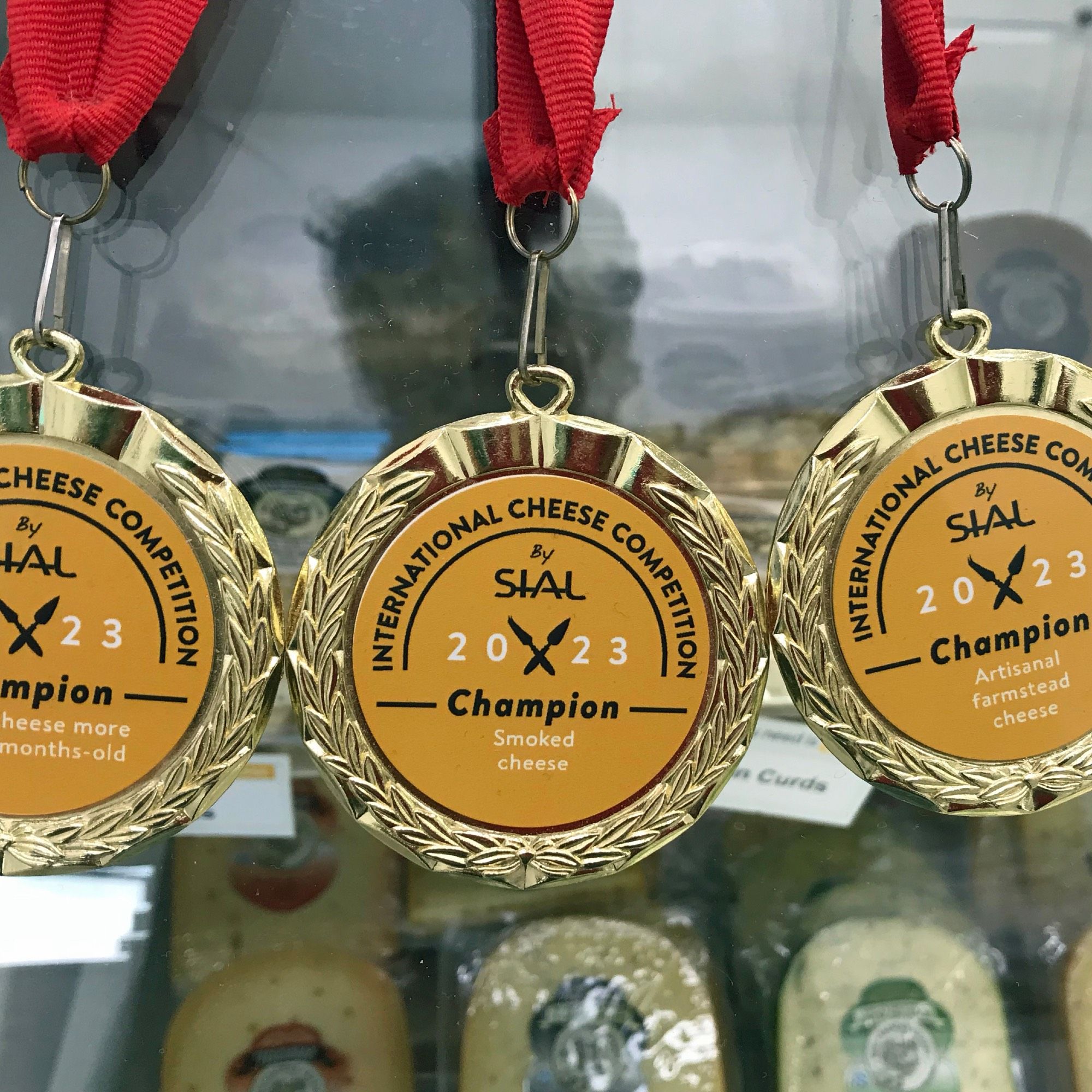 Championship medals from the 2023 Sial International Cheese Competition.