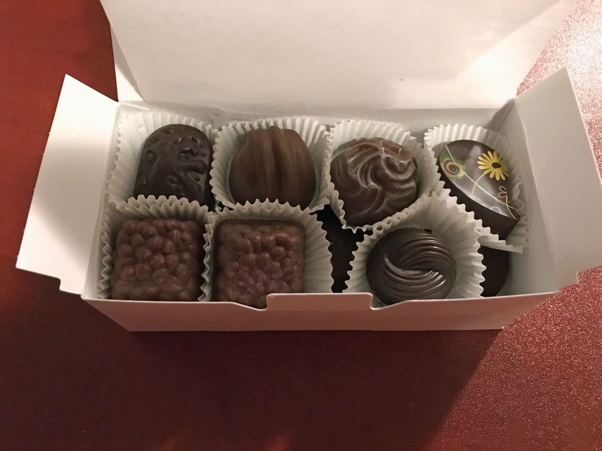 Same box, but the lid is open  showing seven truffles (a row of chocolates is below). I don't remember what I chose...but you can't go wrong.