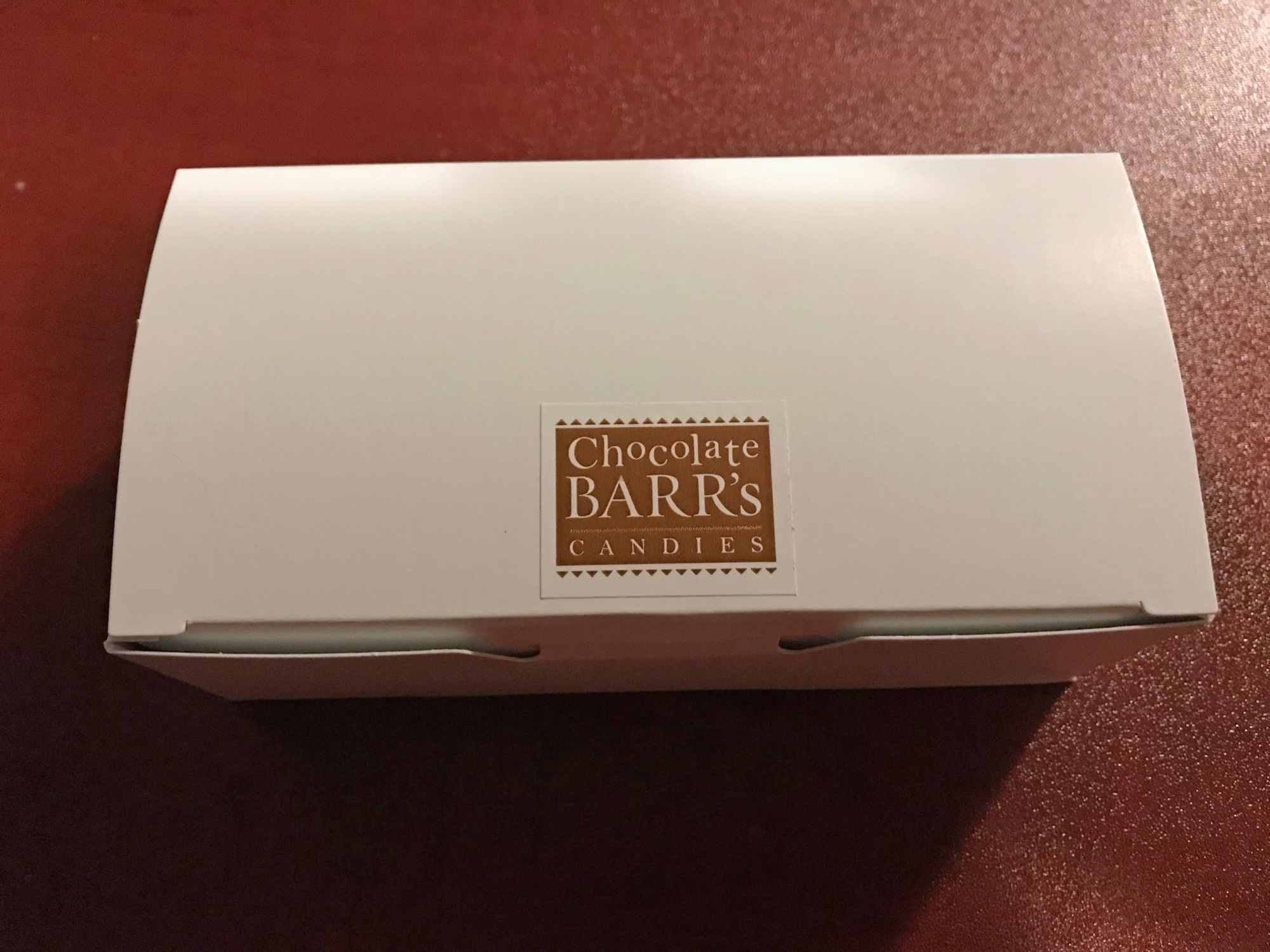 A closed 250g box of chocolates from Chocolate Barr's in Stratford.