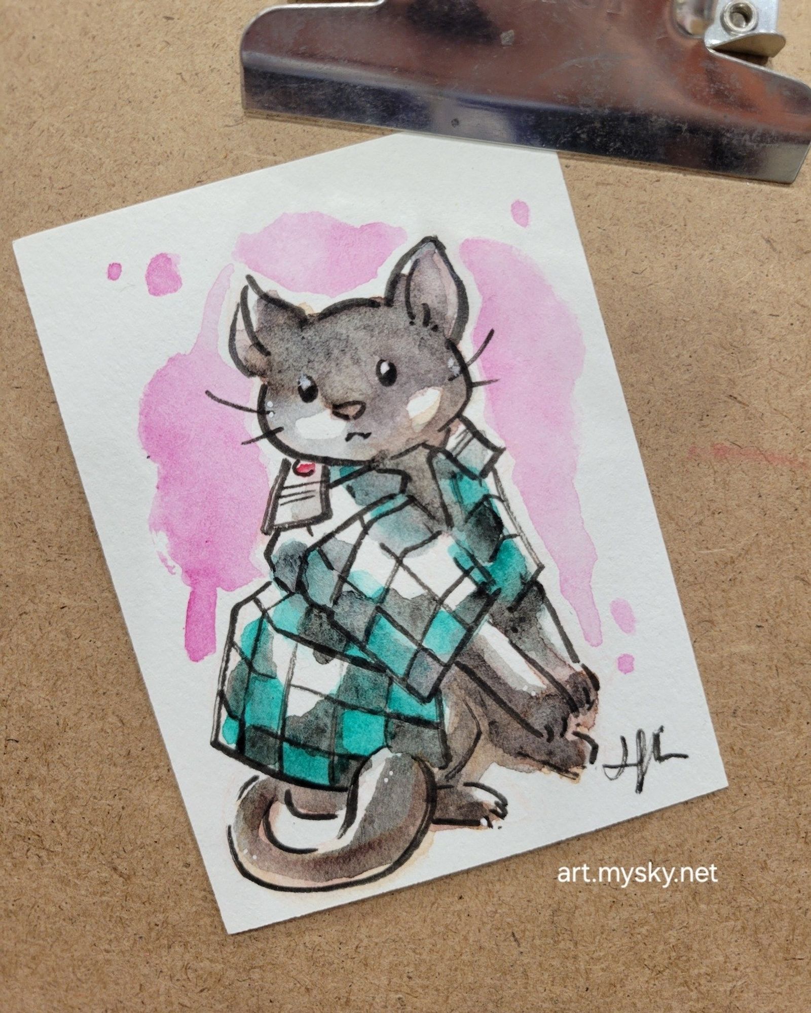 Tiny painting of a black cat in Demon Slayer cosplayer