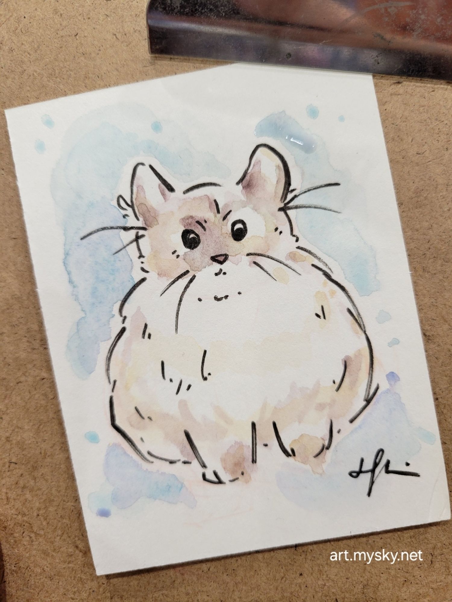 Tiny painting of a marshmallow disguised as a cat