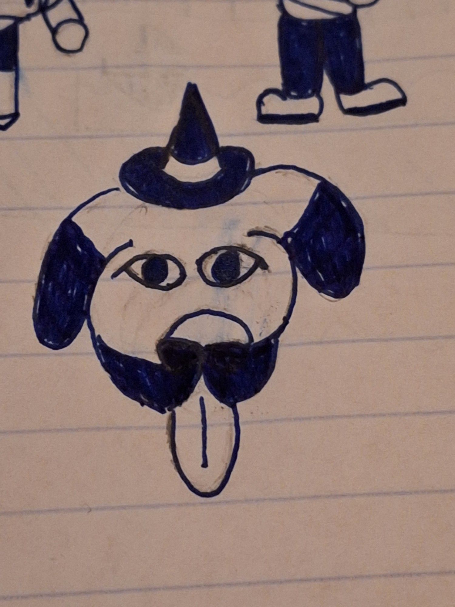 Dog with floppy ears and a tiny witch hat that has its tongue out