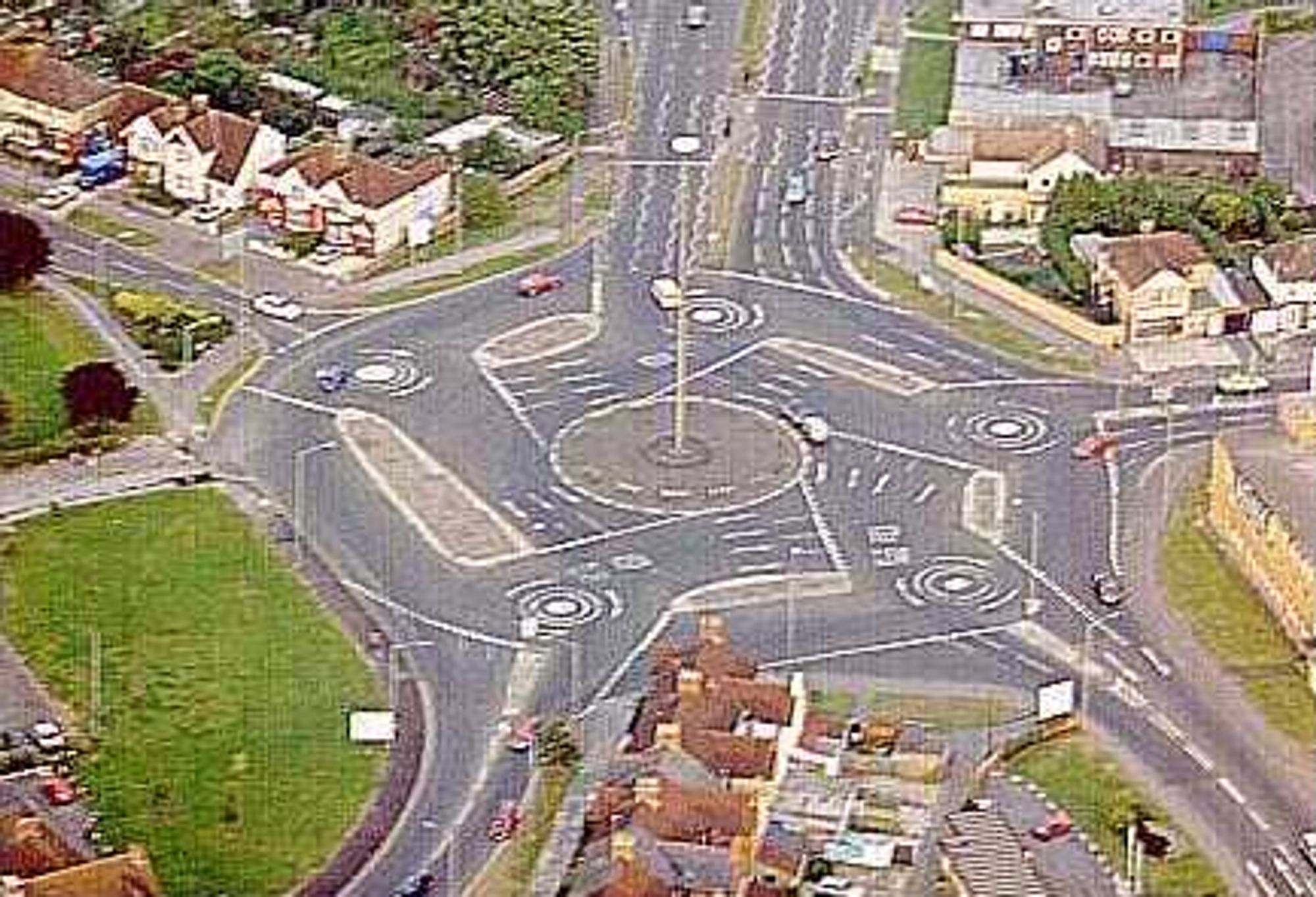 An ariel view of the Swindon "magic roundabout" five mini roundabouts in a circle to make one giant crazy mess that somehow works. Probably not for "self driving" cars though.