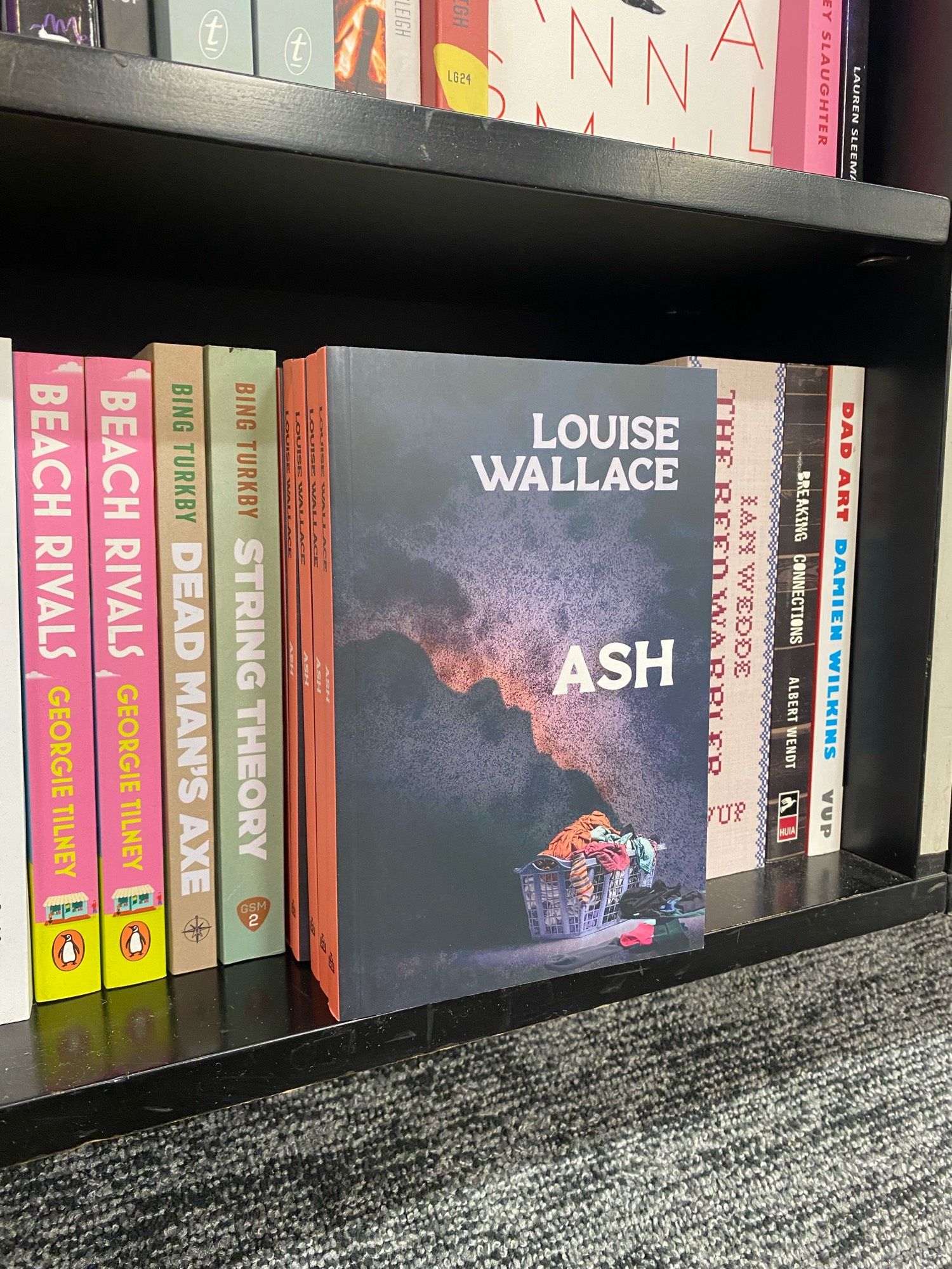 Copies of Ash by Louise Wallace at Unity Books Wellington