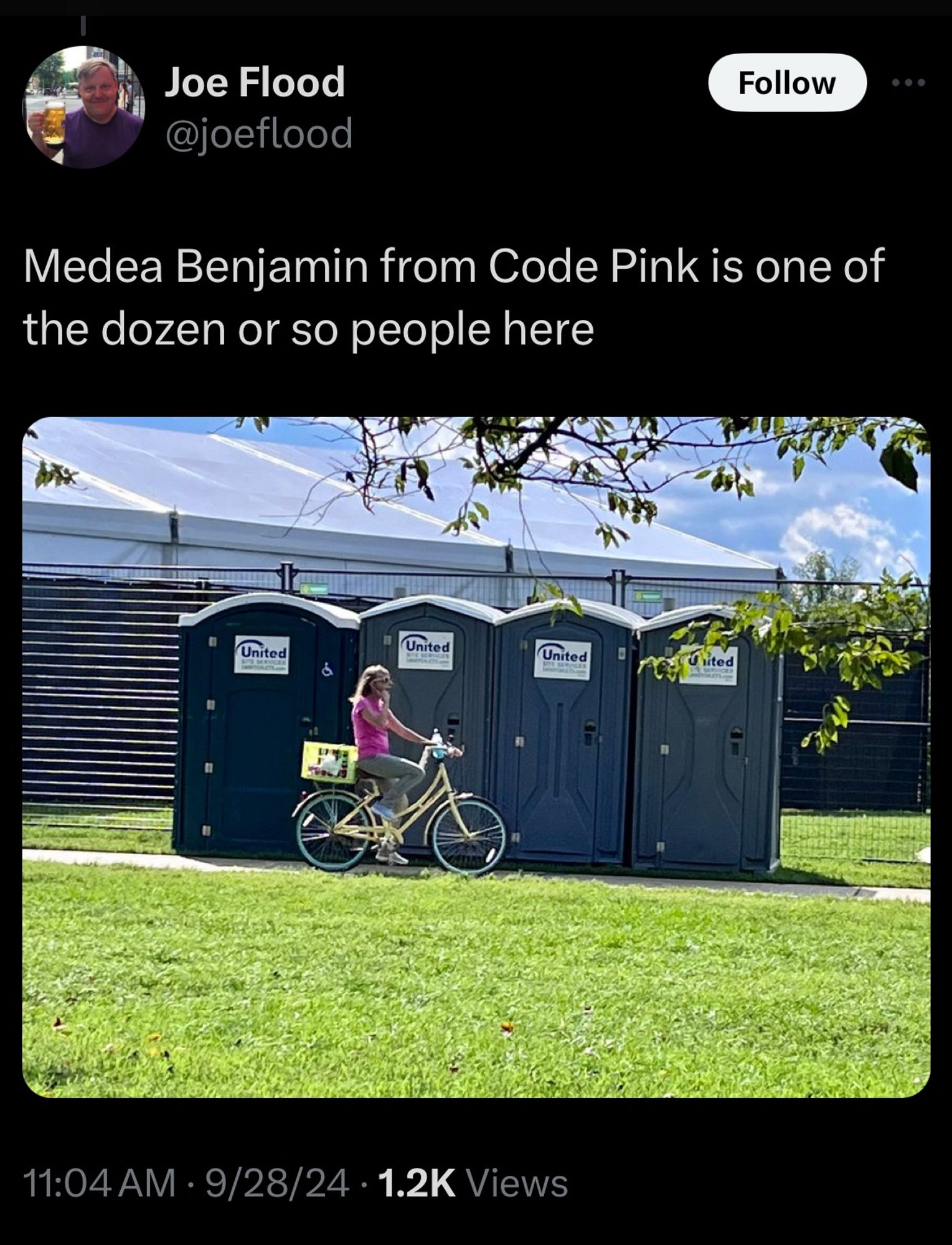 Joe Flood
@joeflood
Pic of Medea Benjamin on a bike wearing a hot pink t-shirt and speaking on a phone in front of four empty port o potties. lol
Medea Benjamin from Code Pink is one of the dozen or so people here