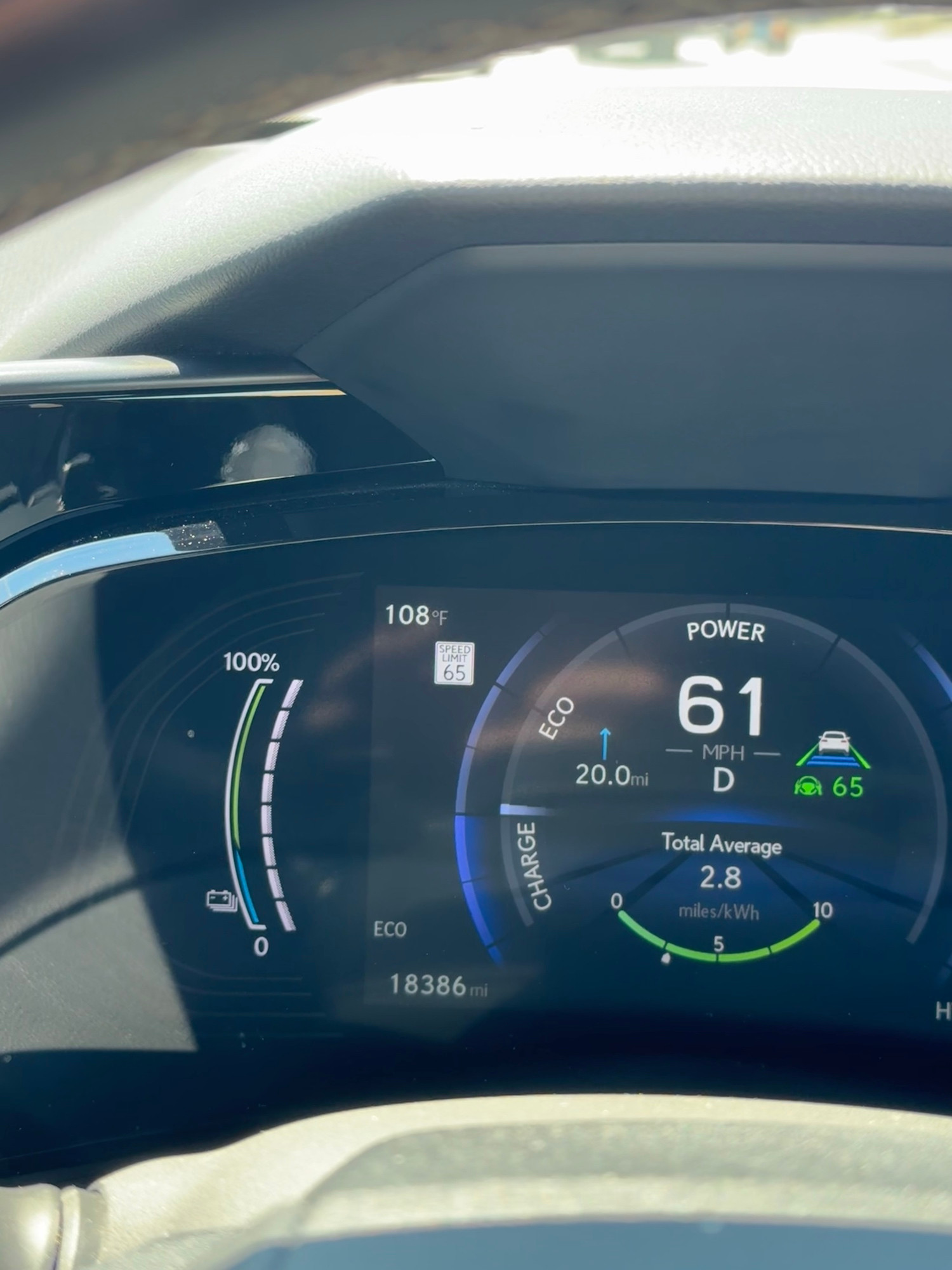 Dashboard showing 108 degrees Fahrenheit, going 61 MPH on the freeway.