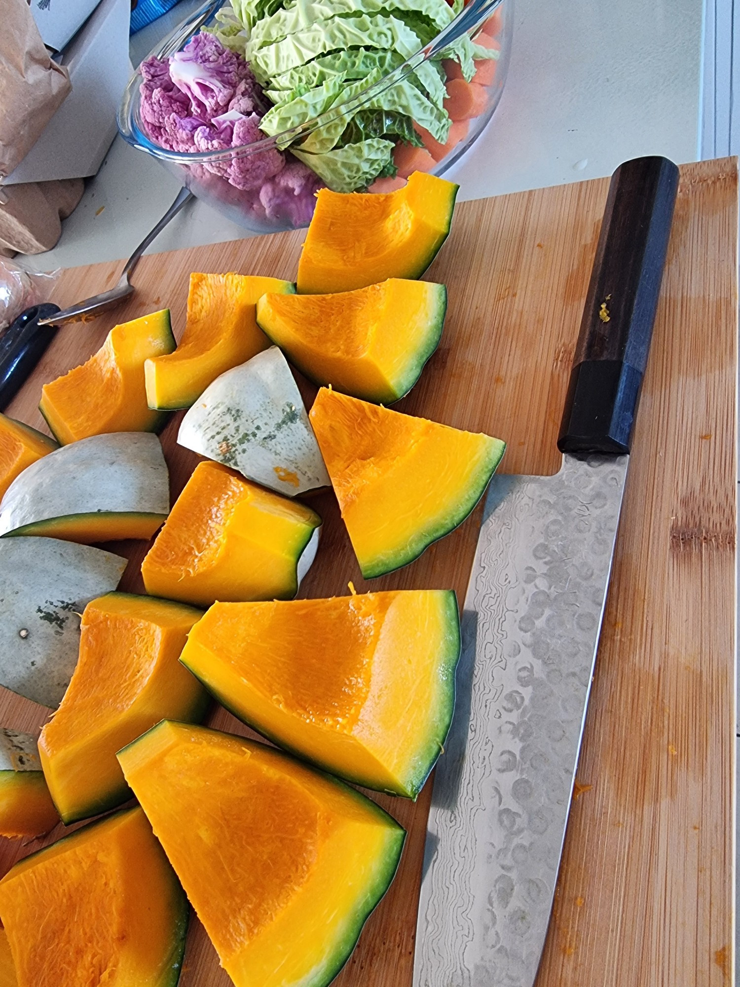 Knife, cut up quash, bowl of vegetables 