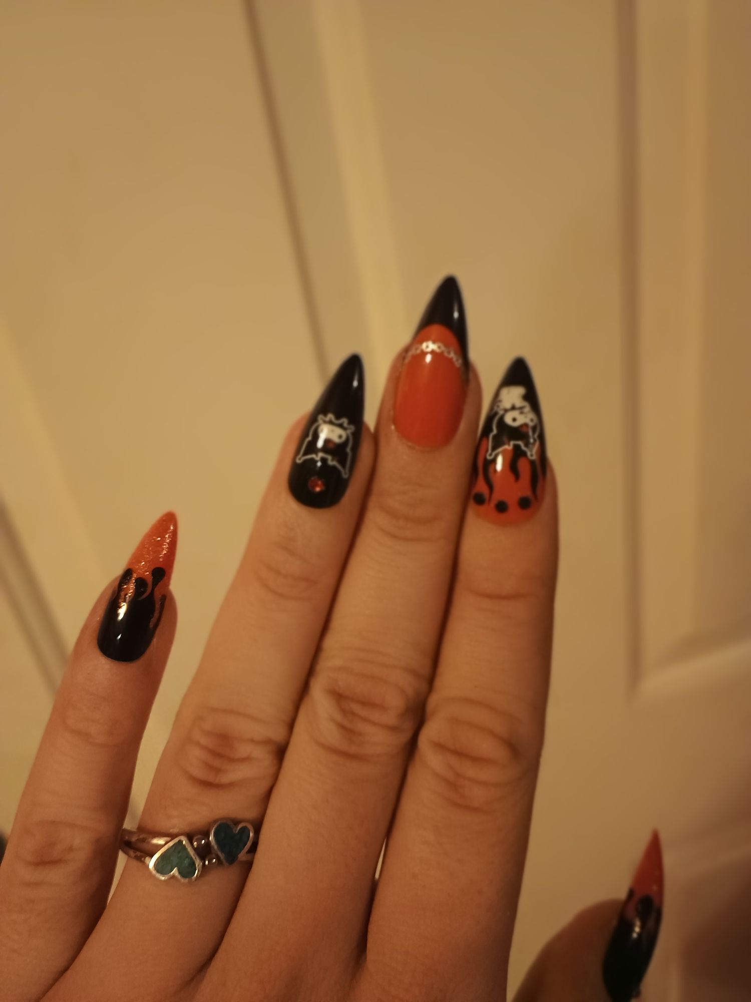 Showing off my red and black Kurami, flames and rhinestone press on nails.