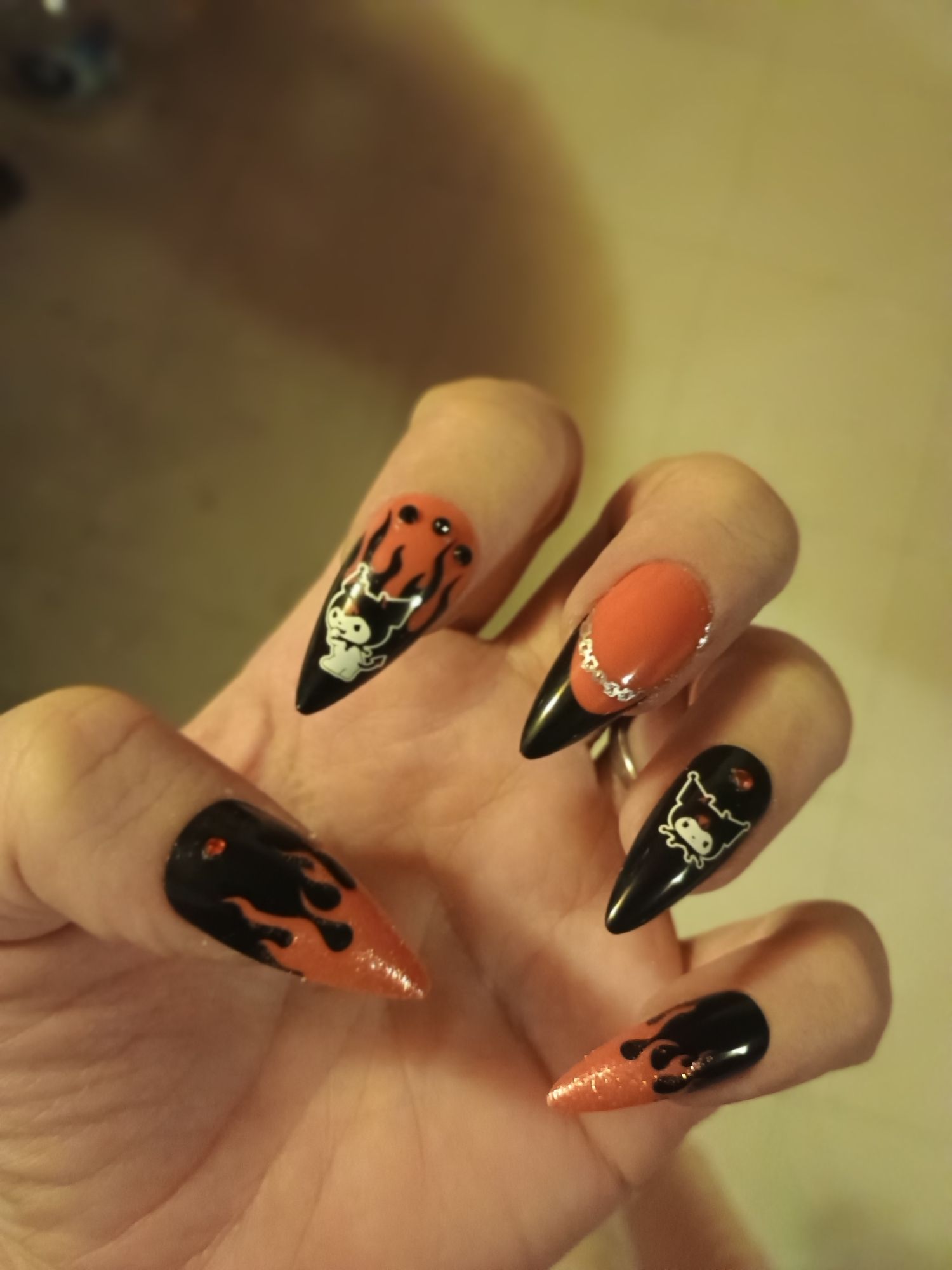 Showing off my red and black Kurami, flames and rhinestone press on nails.