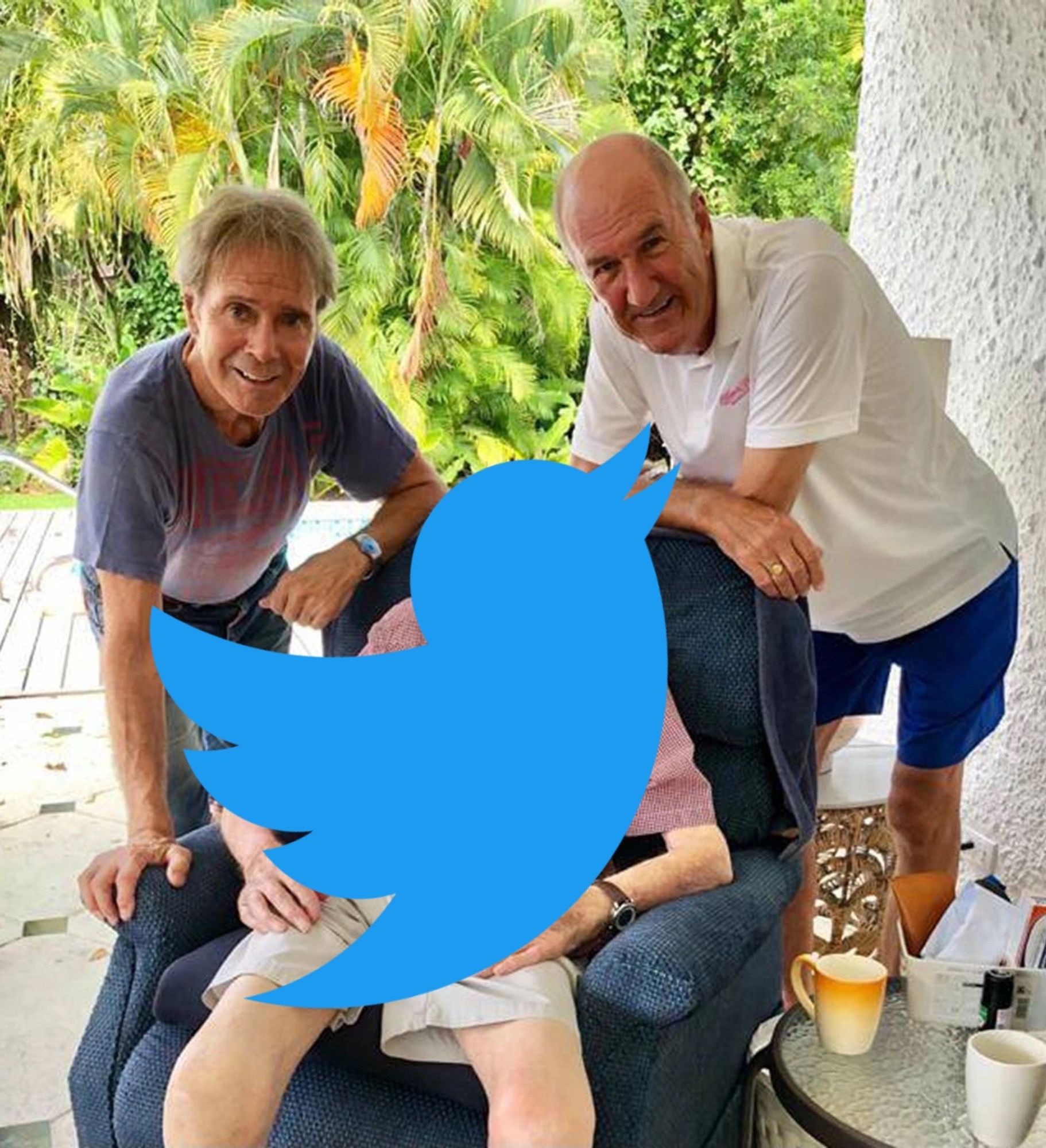 Cliff Richard and Russ Abbot posing with Captain Tom in Barbados, only the Twitter logo is superimposed over Captain Tom, suggesting that - like Captain in this picture - it will perish shortly