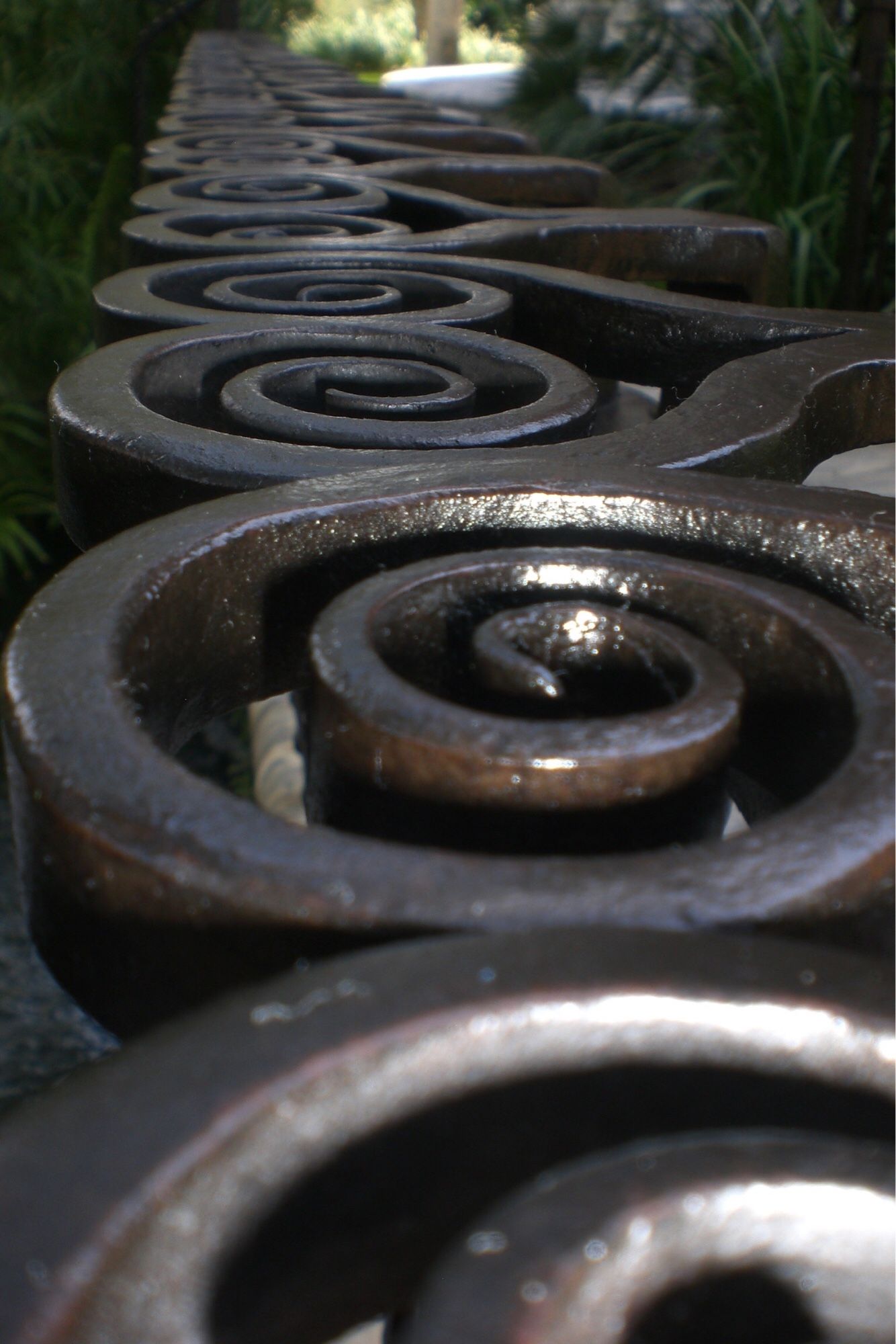 iron decorative coils on a low fence (Bok Gardens, Florida)