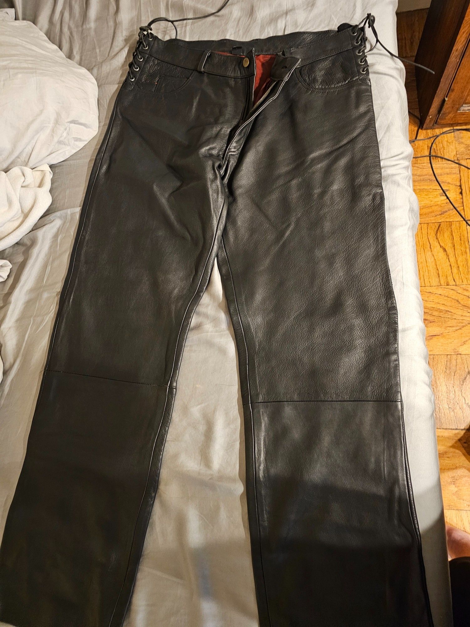 Black leather pants with red lining