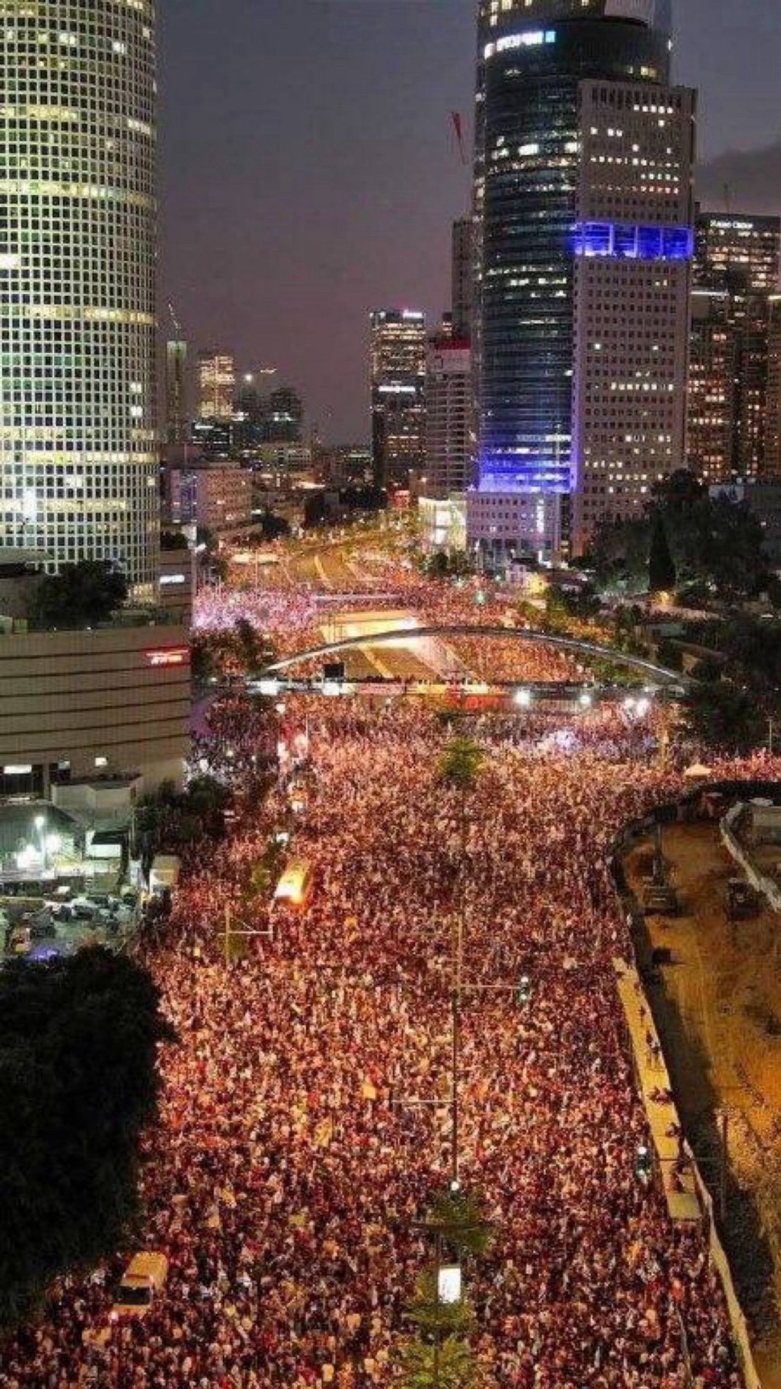 A huge crowd fills a major thoroughfare in Tel Aviv