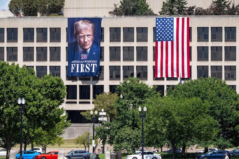 Nazi-style Trump and US flags hanging on a building 