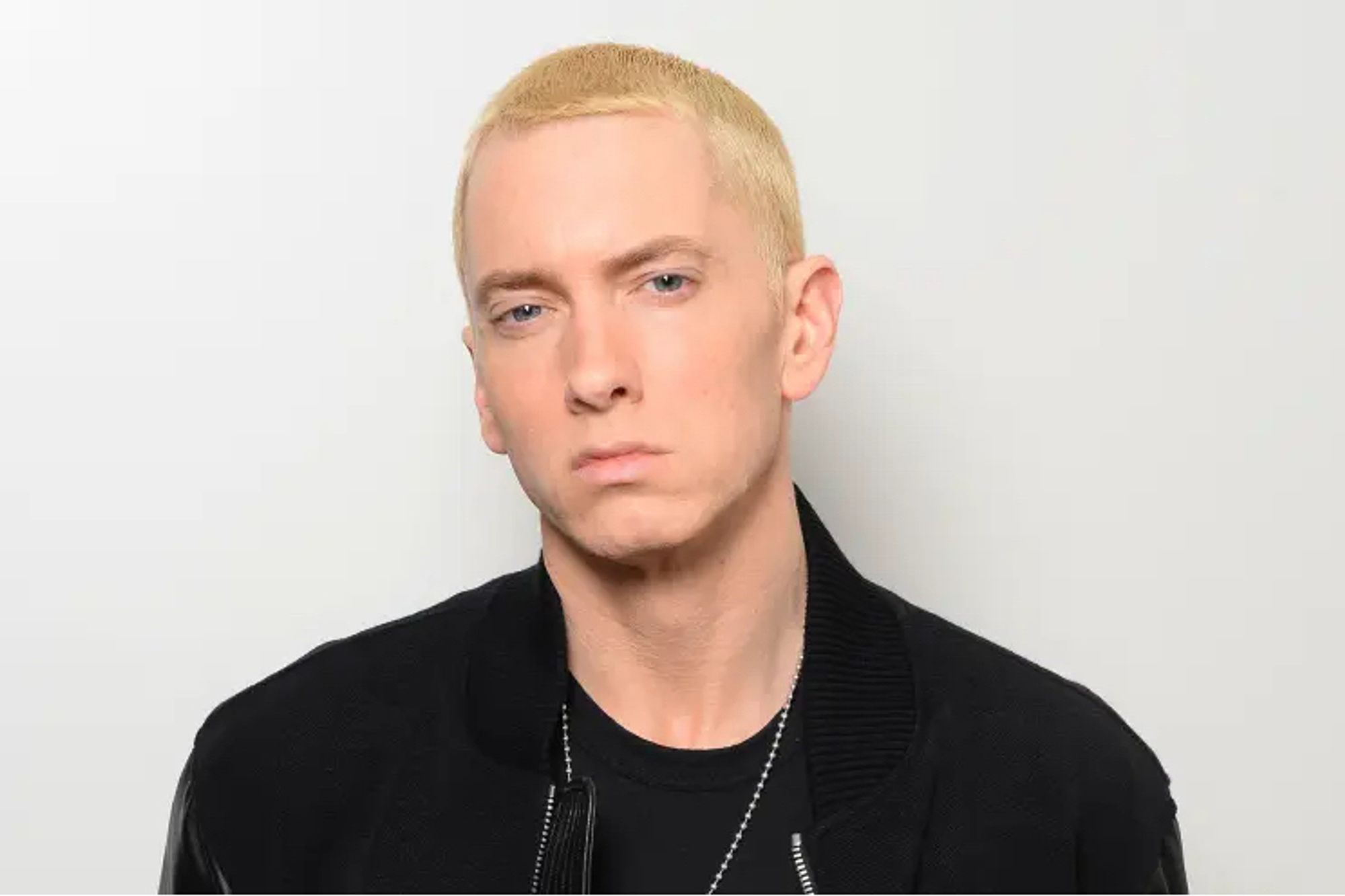 Eminem looking at the camera in a hard way, dyed blonde hair