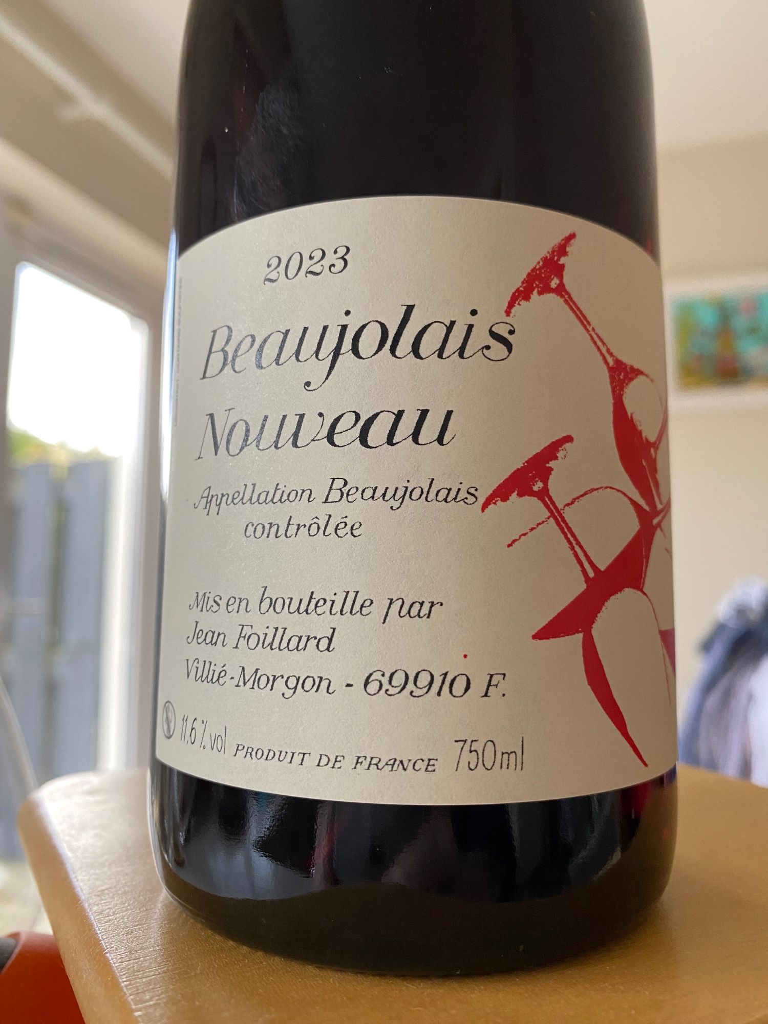 Image shows a bottle of a 2023 release of Beaujolais Nouveau. This type of wine is always released for sale on the third Thursday of November following harvest.