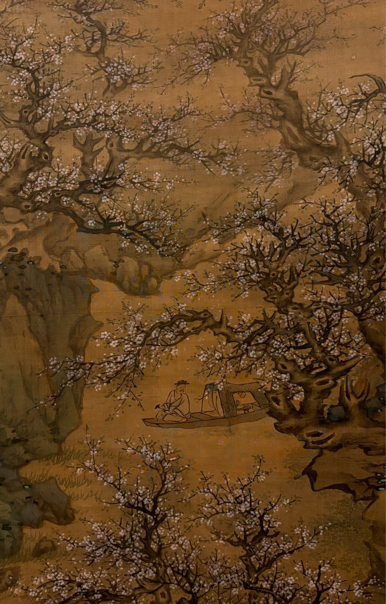 Detail of a Chinese painting: a man in a boat on a stream amid blossoming peach trees. Lan Ying, “The Peach-Blossom Spring,” mid-17th century