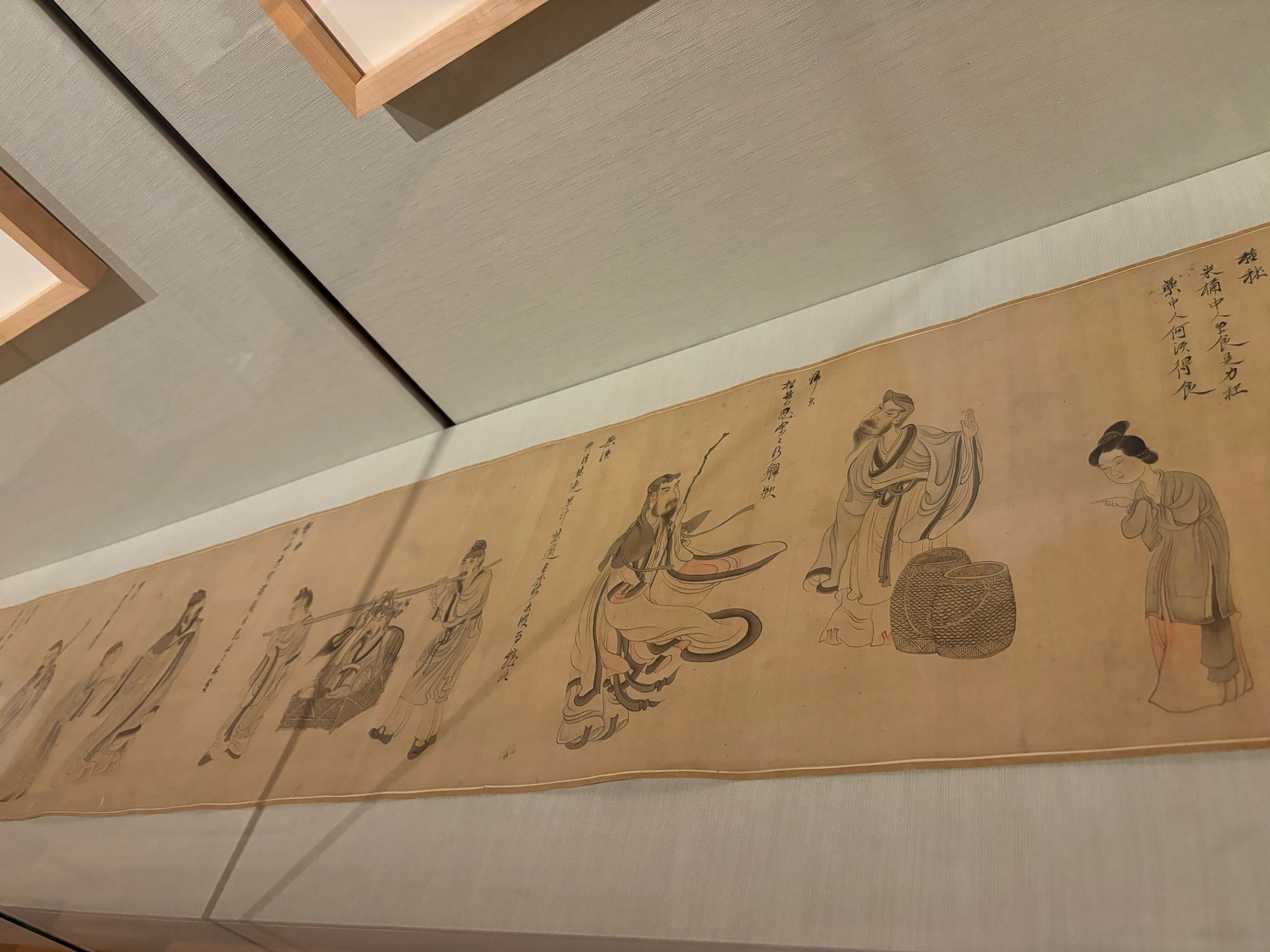 View of a scroll painting unrolled in a glass case: it’s Chen Hongshou’s early 17th century painting of scenes from the life of the 4th-5th century poet Tao Yuanming