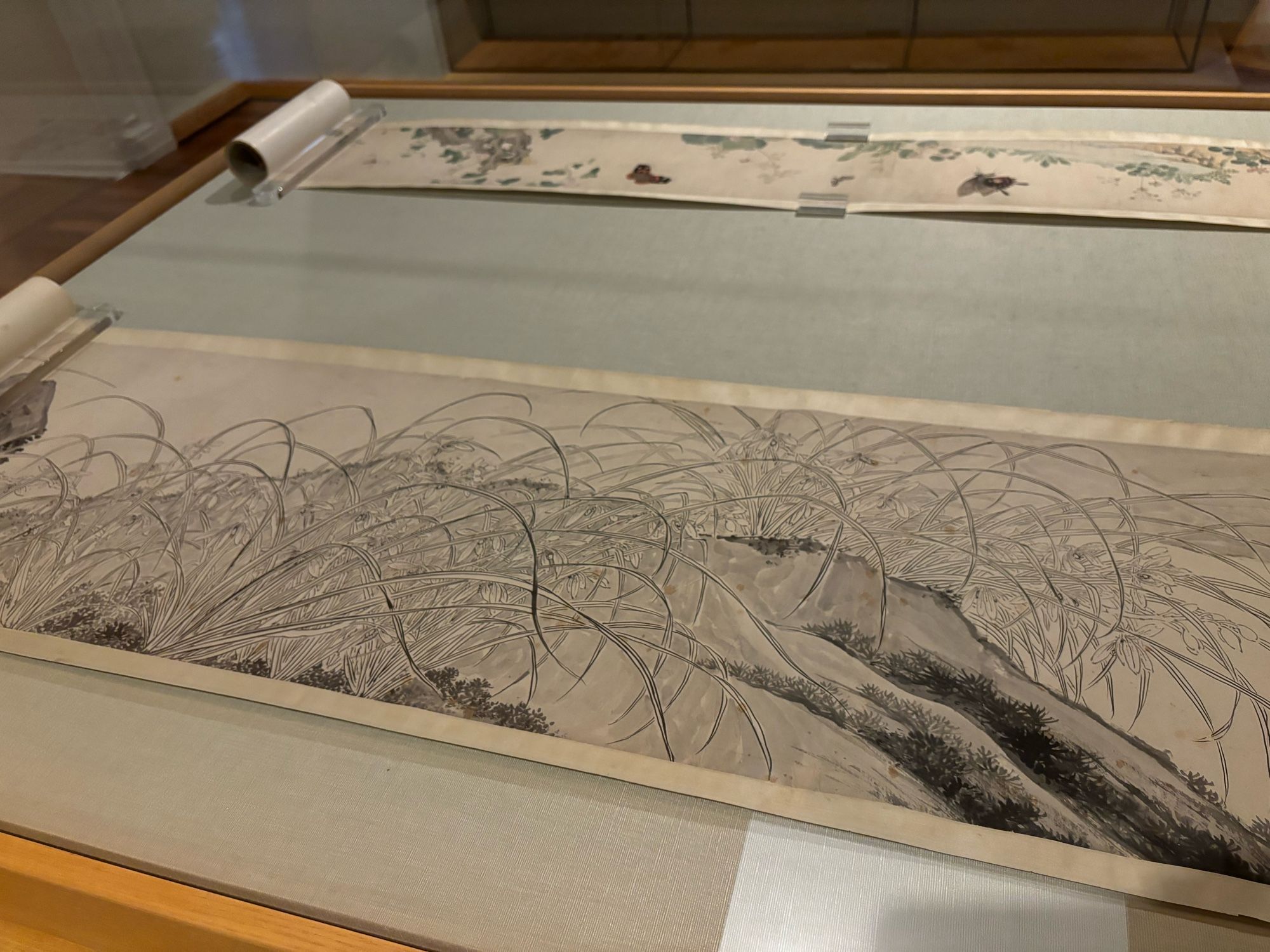 A third scroll painting, “Wild Orchids” by Xue Wu a.k.a. Xue Susu, 1601.