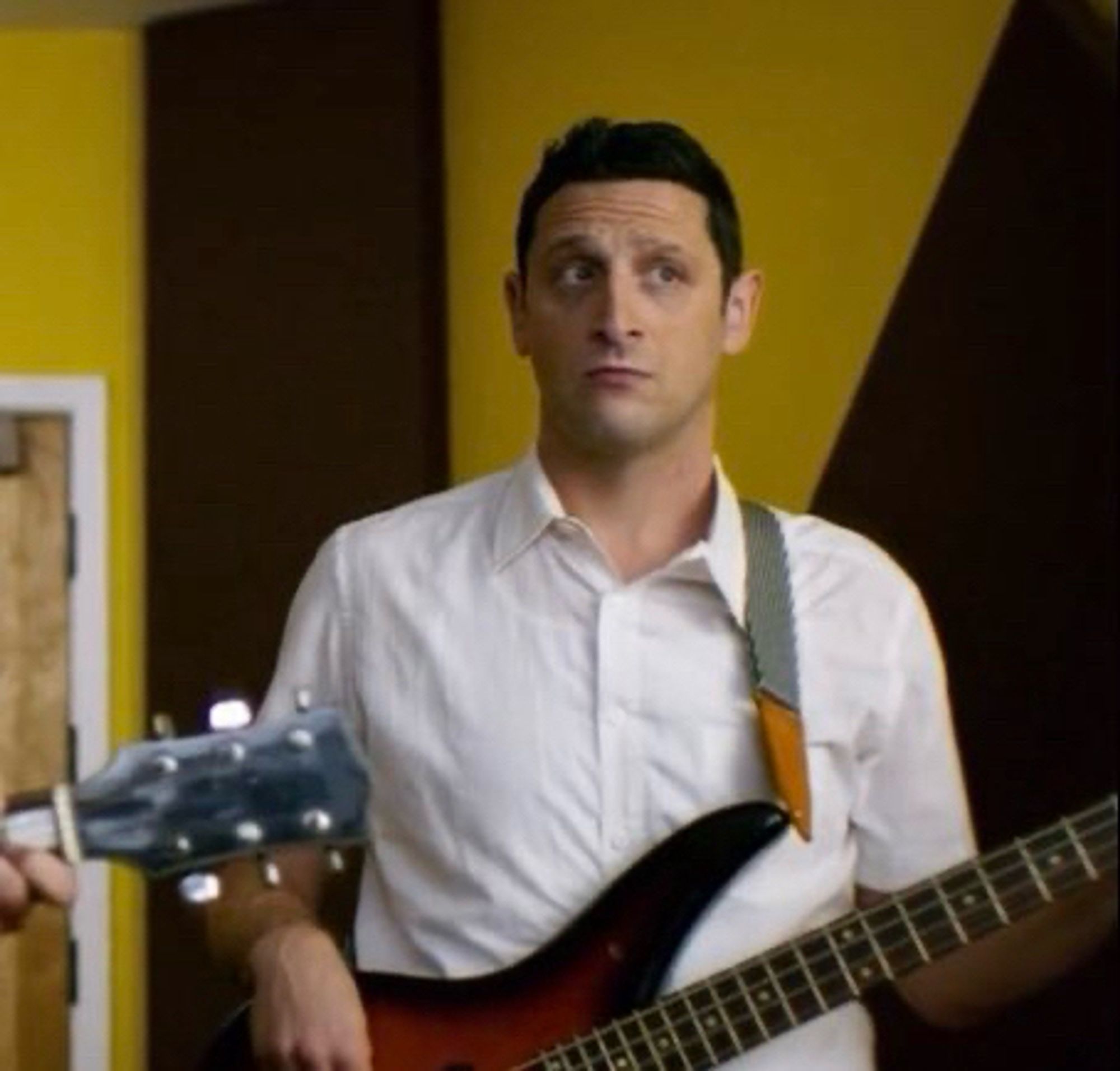 Tim Robinson in the “Bones Are Their Money” before he jumps in, while he’s just casually playing bass