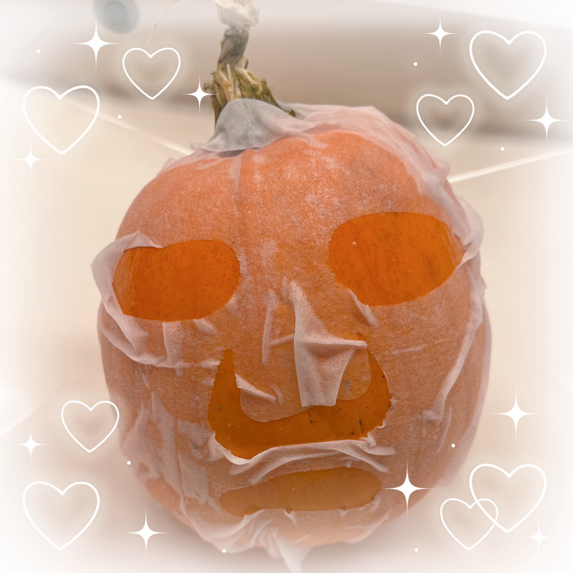 A pumpkin wearing a skincare facemask