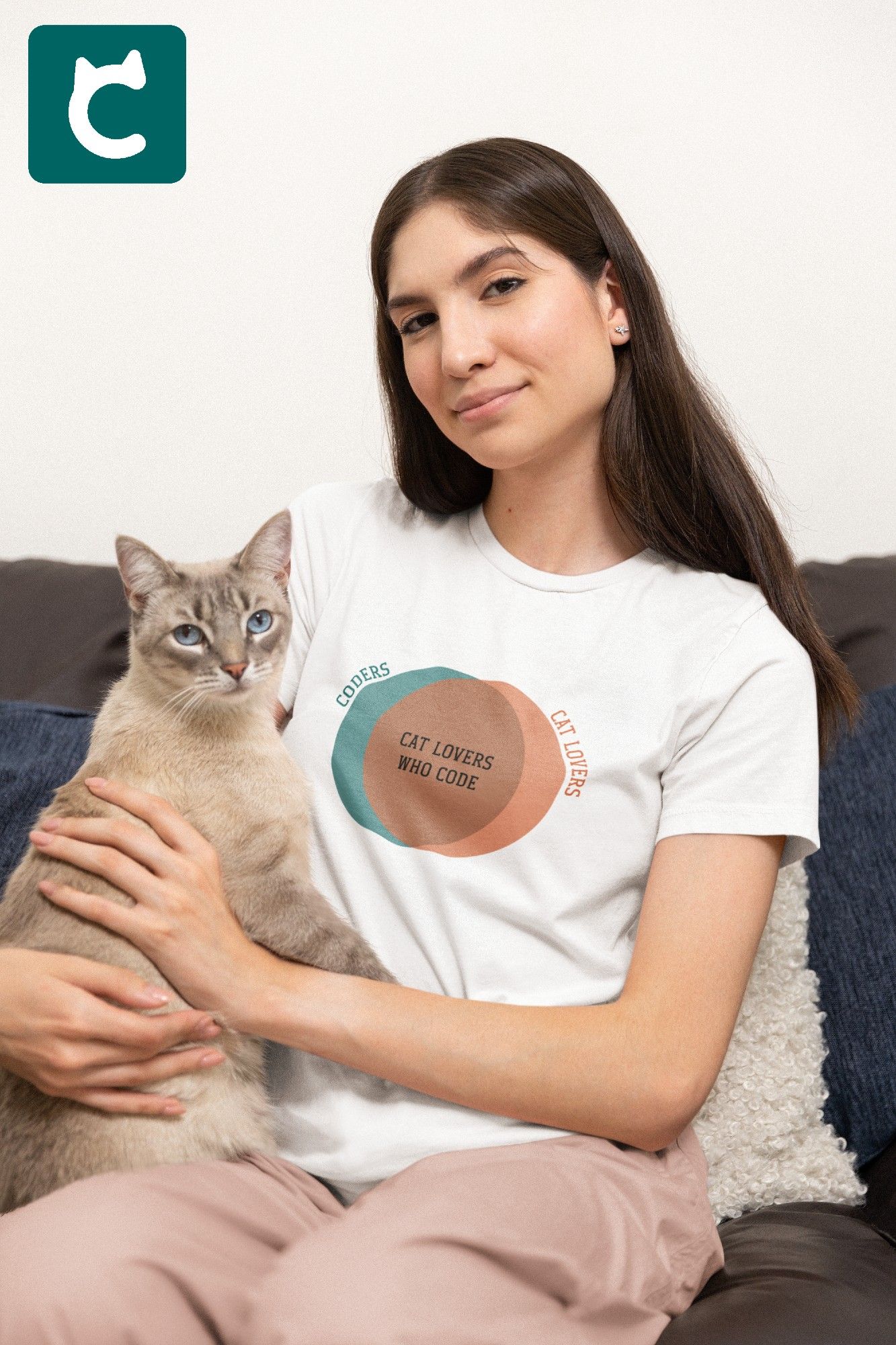 Smiling woman holding cat and wearing white t-shirt with teal and orange venn diagram. The outer sections say Coders and Cat Lovers. The larger intersection in the middle says Cat Lovers Who Code.