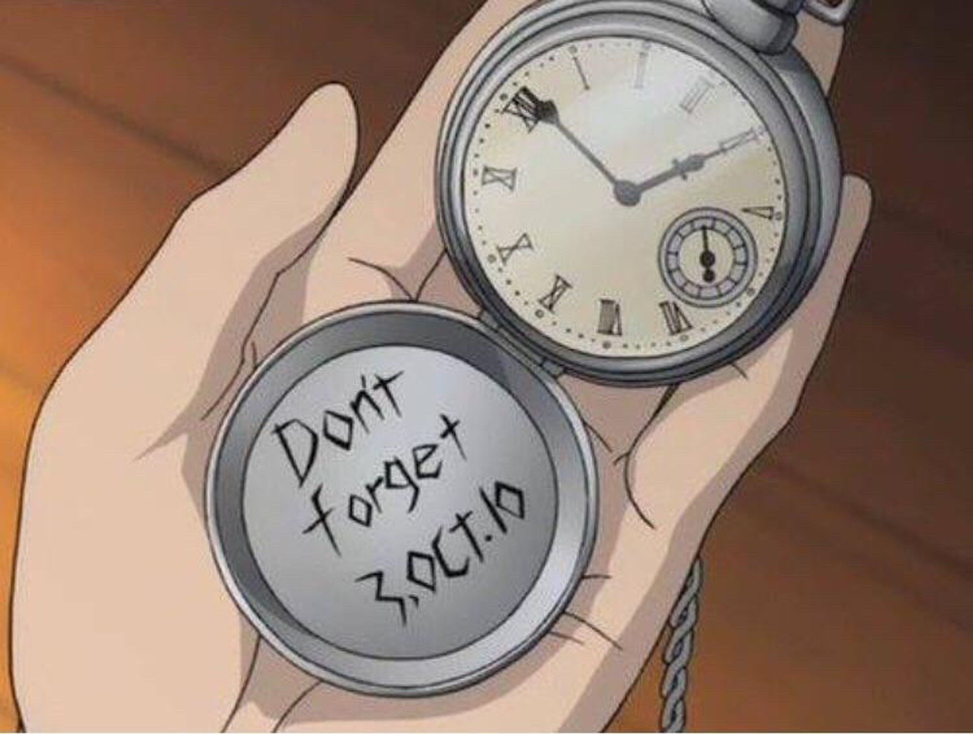 A screen cap of Fullmetal Achemist. Someone’s hand holding an open pockets watch. On the inside of the watch is the crudely done engraving, “don’t forget 3, Oct. 10”  