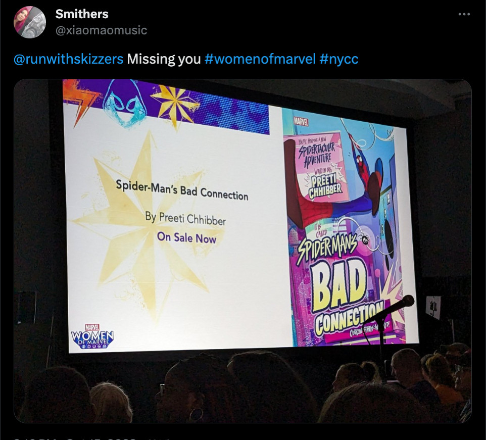 A tweet from @xiaomaomusic that has a picture of a panel at NYCC, the slide shown has a cover of my book, SPIDER-MAN'S BAD CONNECTION and showing that it's on sale now. 

The text of the tweet reads, "@runwithskizzers Missing you #womenofmarvel #nycc"