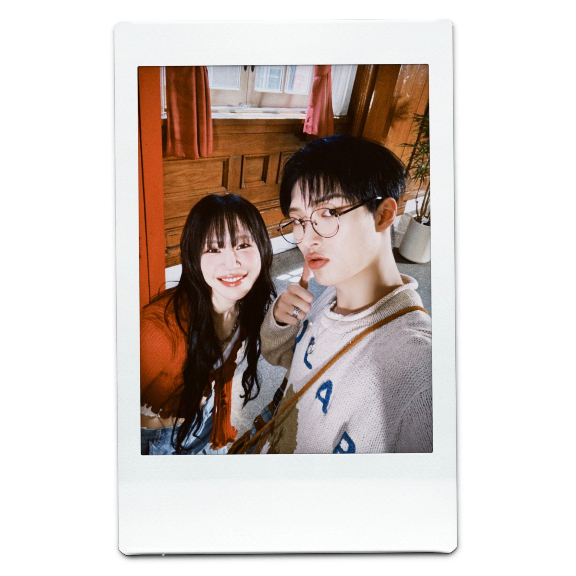 polaroid selfie of kpop rapper mirani with kpop group ateez member song mingi