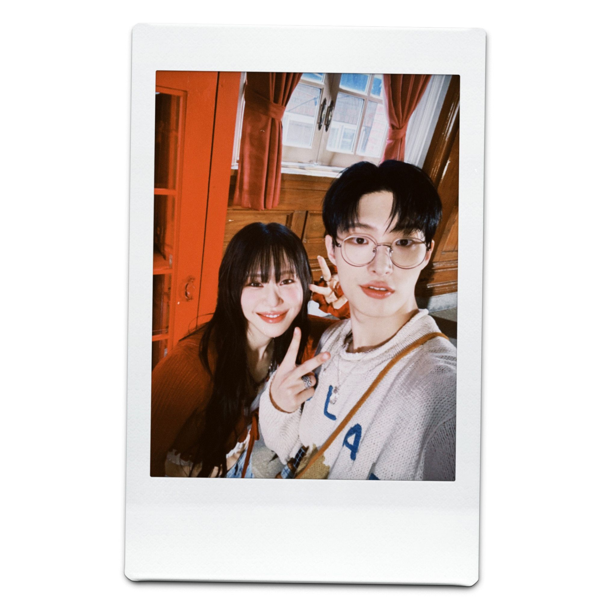 polaroid selfie of kpop rapper mirani with kpop group ateez member song mingi