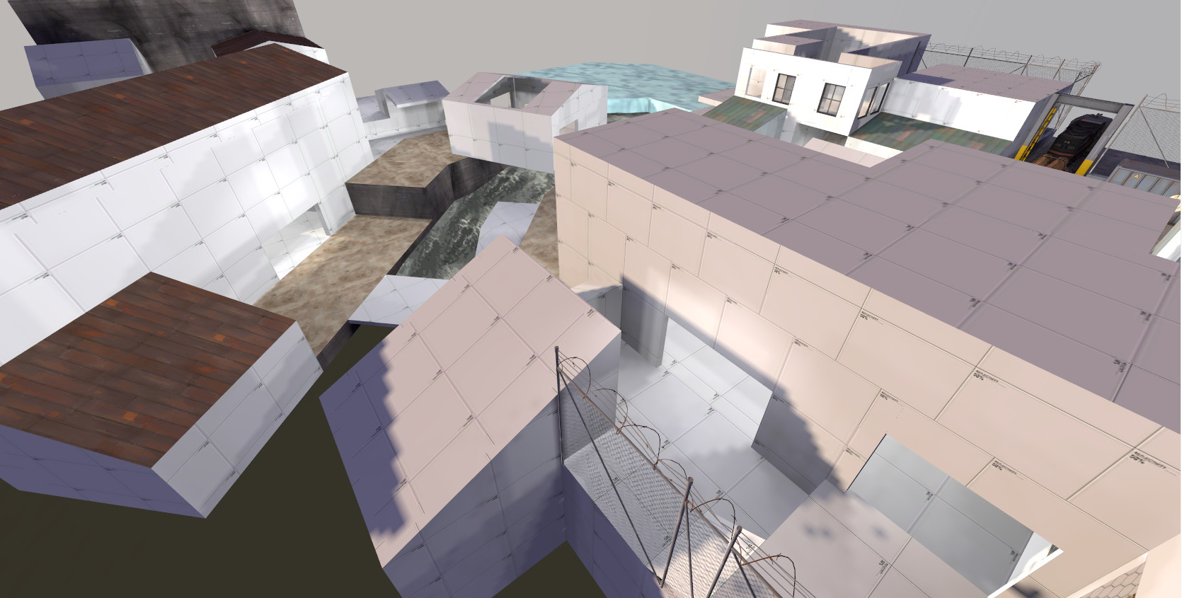 an in-development greybox level for Team Fortress 2, featuring an overhead shot of gameplay area with a stream running down to a river and structures built up around it