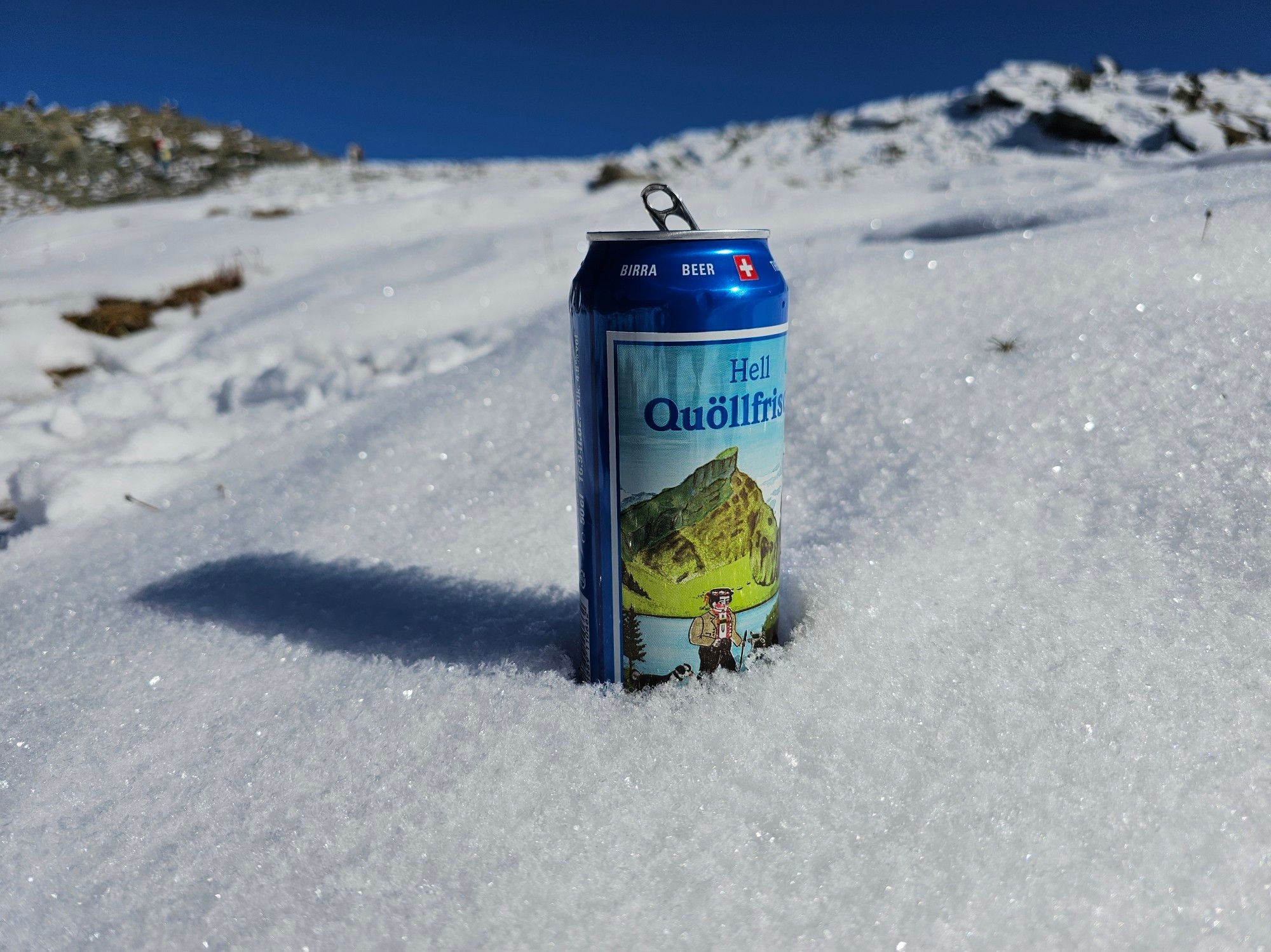 A can of Appenzeller lager in the snow.