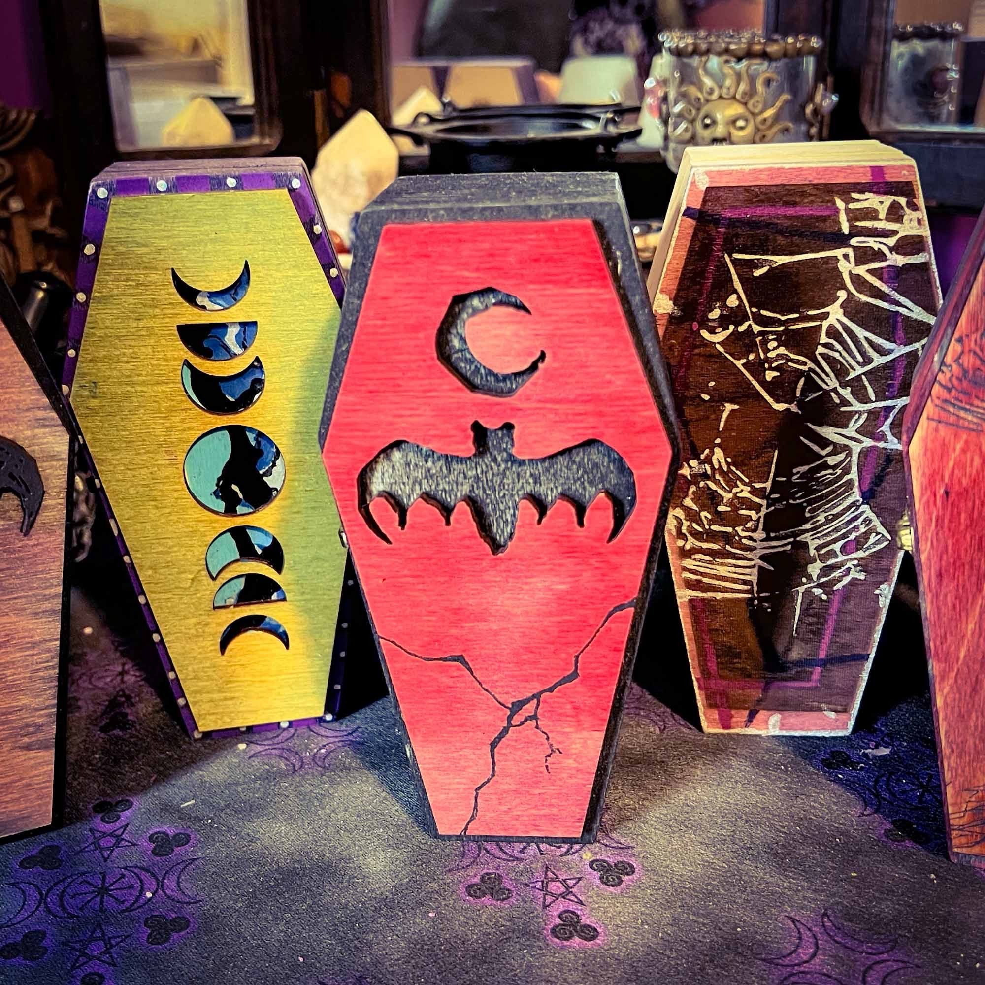 3 hand decorated coffin boxes; moon phase, bat and moon, and new wave spiderweb motifs