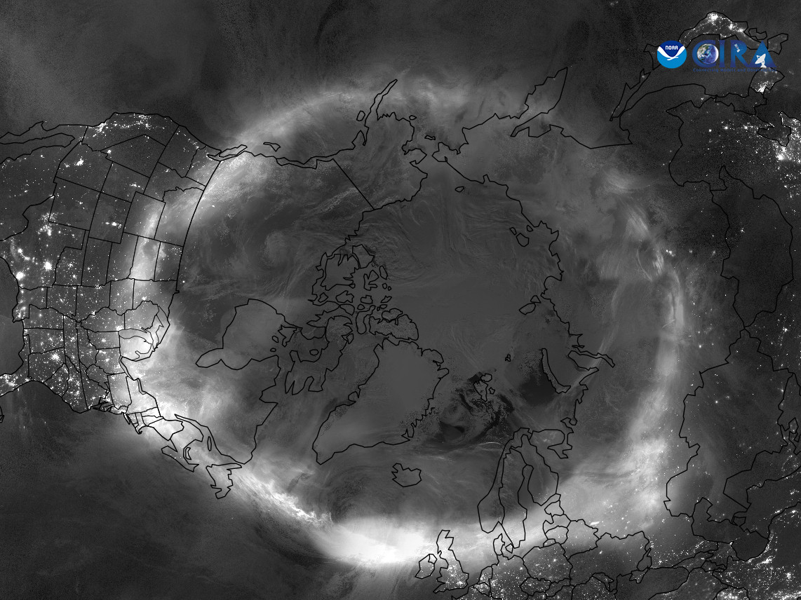 Satellite image of the north pole, showing annotated countries, states and continents. A ring of white light is overlaid on the image, showing the location and intensity of the aurora.